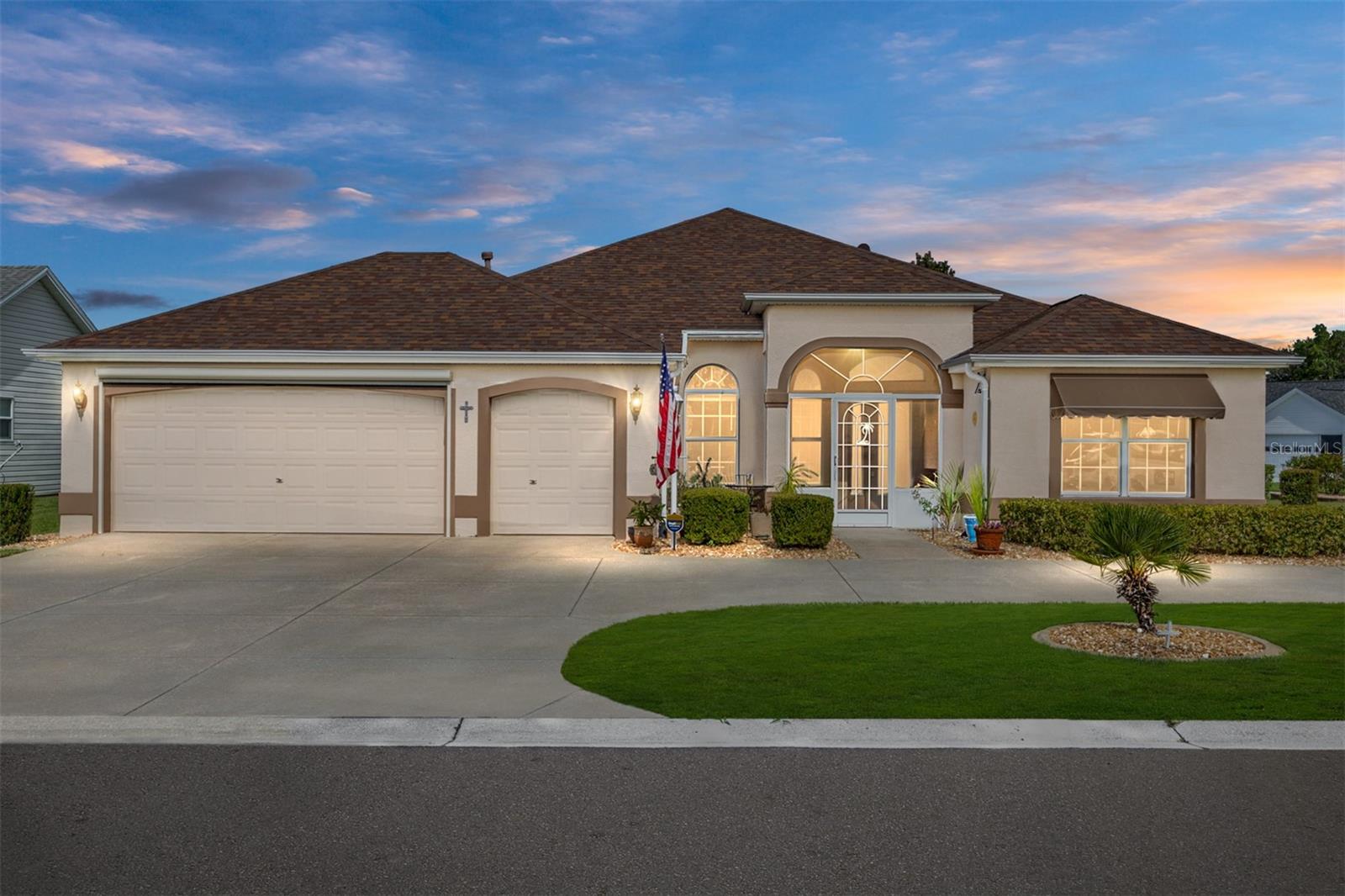 This beautfiul home is a Magnolia model, in the much sought after village of Glenview. It features many extras including stainless appliances, gas range, and beautiful kitchen area, opening to a nice sized family room and dining room. It has a professionally finished Florida room, with real glass windows and is oversized. It features a separate patio and sitting area, outside the the Florida room, and a beautifully landscaped yard on a large corner lot. In the primary bedroom there are two very large walkin closets and a walk-in tub and shower in the bathroom as well. There is no carpeting in the house and the floors are Luxury Vinyl Plank and tile. This designer home has a two-car garage plus a golf cart garage and the owners added screening outside for year around ventilation and comfort even inside the garage. the garage also features and extra large walkup staircase. NO BOND, The roof was replaced in 2020, the HVAC in 2022 and water heater in 2018. There is no popcorn ceiling and you will notice driving up to the house, a large circular drive way with beautiful landscaping. The owner has prepaid both preventative termite and pest control through April of 2026. Come see this lovely home, in a great area and make it yours.