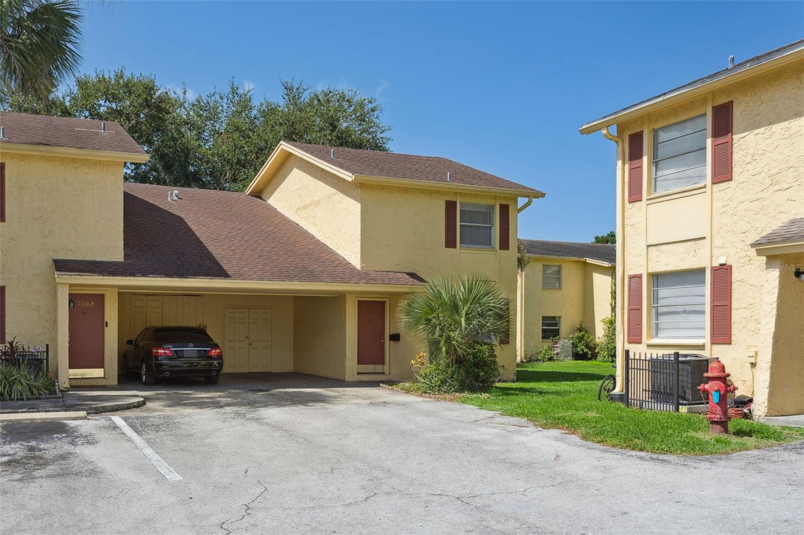 One or more photo(s) has been virtually staged. Spacious 3-bedroom, 2.5-bath condo with OVER 1,500 SF of living space in a desirable TAMPA location within Town N Country. All bedrooms are oversized with walk-in closets, and the laundry room is conveniently located upstairs with the bedrooms. Interior highlights include granite countertops, white shaker cabinets, tile and wood flooring throughout, with carpet only on the stairs. Exterior perks include a covered carport and attached storage closet. Located in the community of The Greens, residents enjoy access to two community pools, a fitness center, tennis courts, and a community laundry facility. The monthly HOA fee covers roof replacement, building exterior and grounds maintenance, water, sewer, trash, landscaping, and all amenities. This is the ideal low-maintenance home base with quick access to Tampa International Airport, the Veteran’s Expressway, and downtown Tampa.