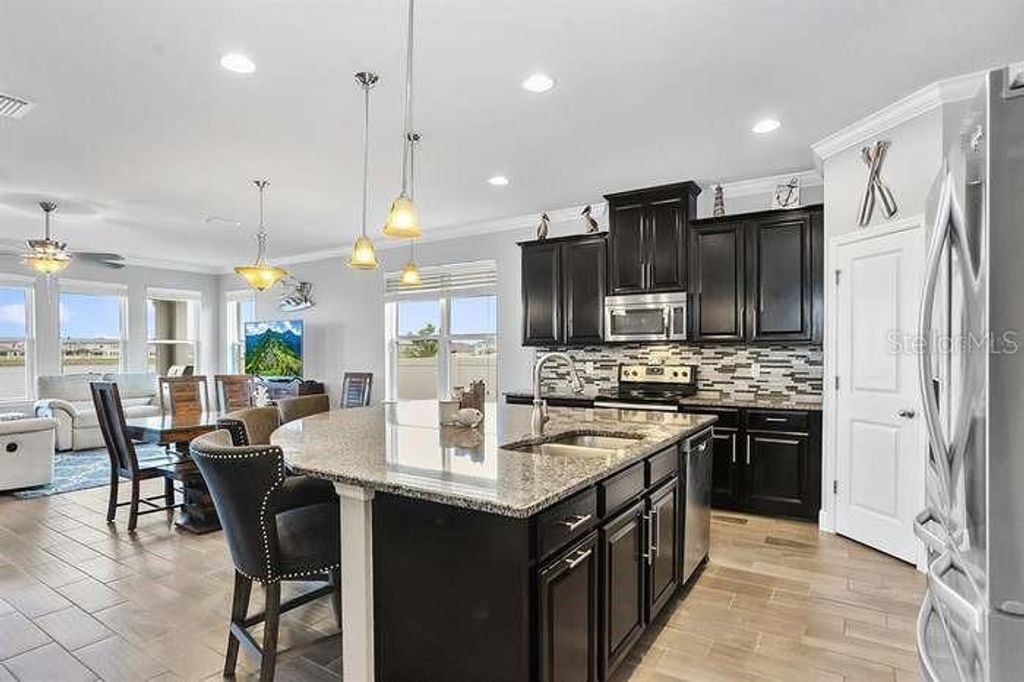 Photo of 19421 Long Lake Ranch Boulevard, Lutz, FL 33558 (MLS # TB8466463)