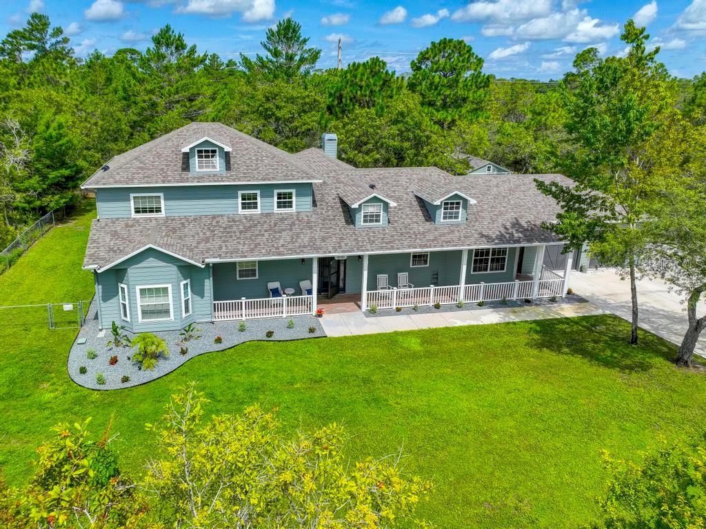 Privacy Prevails!! This Gorgeous Country Style pool home is exquisitely situated at the end of a quiet Cul de sac with a huge and lushly 1.25 acre landscaped home site and a serene and private backyard. A commanding mammoth front yard and glass leaded doors welcome you to a spectacular luxurious inviting indoor living with gleaming wood and tile floors throughout. As you enter the home either through the attached oversized 2 car garage or the front entrance, you are greeted by a warm expansive, elegantly lighted hallway. If you love cooking, the completely remodeled state of the art kitchen is truly a chef's dream with its endless cabinetry and exquisite Quartz island and counter tops. The home boasts 3500 sq ft of great living space, the main floor features 4 bedrooms, 3 full baths, a laundry room, family room for entertaining and a massive dining room with built in cabinets and gas fireplace. The spacious master bedroom is on the second floor, includes a sitting / workout room, a reading nook, and a cedar lined walk-in closet. The master bath has double vanities, a free standing claw foot tub to relax in and a walk-in shower with double shower heads and gorgeous inlay details. Included upstairs is a finished attic with closet space to convert to a bedroom or use as a craft room. This house is massive with upgrades galore including high end foam insulation to keep electric costs low, a central vacuum system, irrigation system and an additional fuse box wired for generator back-up. The outdoor living space is endless as French doors open from the living area to a sparkling 14 x 28 heated salt chlorinated pool with paver decking, screened in lanai and ceiling fans. The fenced in backyard offers additional privacy with mature oak trees and a large 16 x 24 storage shed. Perfect home for a family or as a vacation rental investment with easy access to beaches, entertainment and Tampa International Airport.
This house comes with a REDUCED RATE through List & Lock™. This is a seller paid rate-buydown that reduces the buyer’s interest rate and monthly payment. Terms apply, see disclosures for more information.