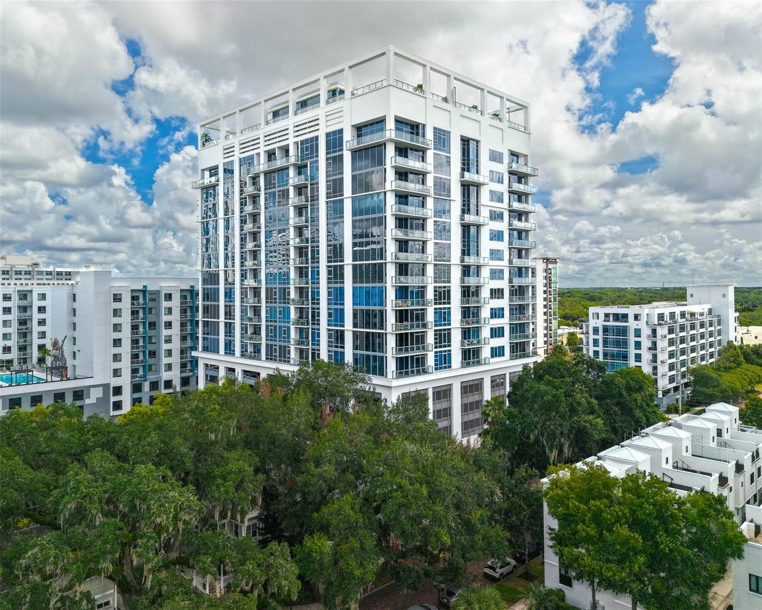 Welcome to Star Tower, where sleek modern design meets effortless city living. Available for lease, this 2-bedroom, 2-bath luxury condo with a versatile flex space—perfect for a dining room, den, or home office—offers both style and functionality in one of Orlando’s most walkable neighborhoods.
Located in the desirable South Eola area of the Thornton Park District, Star Tower is a boutique high-rise where luxury and artistic influence converge. Step outside your door to enjoy cafés, art galleries, local boutiques, and tree-lined streets. Spend weekends at Lake Eola Park, stroll through Constitution Green’s off-leash pet park, or take in a show at the Dr. Phillips Center for the Performing Arts.
Inside, the freshly repainted condo features brand-new designer carpet in the bedrooms and soaring 10-foot floor-to-ceiling windows that fill the space with natural light. West-facing views from the 6th floor highlight the Downtown Orlando skyline and can be enjoyed from the oversized private balcony—ideal for relaxing or entertaining.
The split-bedroom layout includes engineered hardwood floors in the main living areas, soft-close European cabinetry, blackout drapes, and custom walk-in closets in both bedrooms. The spa-like primary suite offers a large walk-in shower, soaking tub, private toilet, dual Quartz vanities, and updated lighting. A second full bath features a sleek walk-in shower and modern upgrades. The chef’s kitchen is equipped with premium appliances, including a Sub-Zero refrigerator, Miele dishwasher, range, convection oven, and Wolf microwave. A spacious utility room provides extra storage and space for bikes.
Residents of Star Tower enjoy access to rooftop amenities including a heated saltwater lap pool, separate Jacuzzi with new shade structure, two grills, a Zen garden, and 360° panoramic views of the city skyline. Additional perks include 24/7 concierge and security, gated entry, a resident gym, and one assigned covered parking space.
Experience refined, turn-key living in the heart of Downtown Orlando—luxury, convenience, and walkability