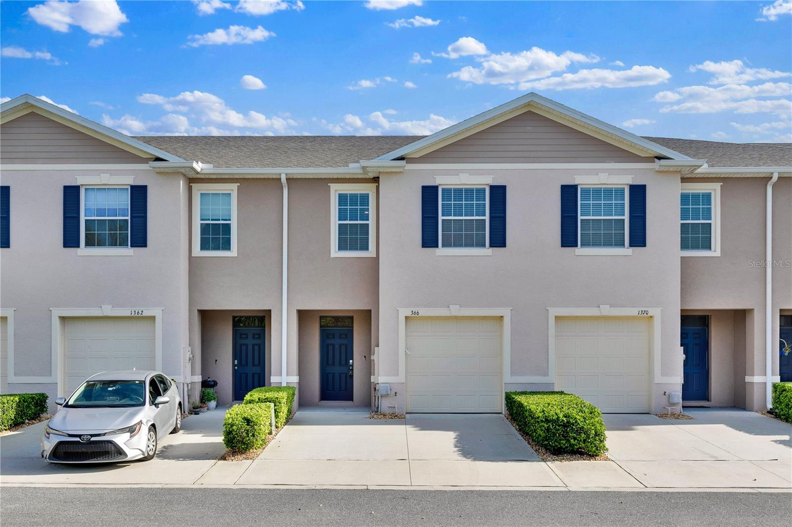1 or more photos have been virtually staged. Welcome to this beautifully maintained 3-bedroom, 2.5-bathroom townhouse located in a desirable gated community, just minutes from Disney. This home offers a perfect blend of comfort, convenience, and style. As you step inside, you’ll be greeted by an open and inviting floor plan, with plenty of natural light flooding the living spaces. The spacious kitchen features modern appliances, ample counter space, and a cozy dining area—ideal for hosting friends and family. The living room is perfect for relaxing, with enough room for both lounging and entertaining. Upstairs, the master suite is your private retreat, complete with a generous closet and a luxurious en-suite bathroom with double vanities and a walk-in shower. Two additional well-sized bedrooms share a beautifully appointed full bathroom. This home also boasts a convenient attached garage, providing secure parking and additional storage. Step outside to your covered patio, a serene spot to enjoy your morning coffee or unwind in the evening. With shopping, dining, and entertainment just around the corner, you’ll never be far from everything you need. Plus, with Disney only a short drive away, this location offers endless opportunities for fun and adventure. Don't miss the chance to make this exceptional townhouse your own—schedule a tour today!