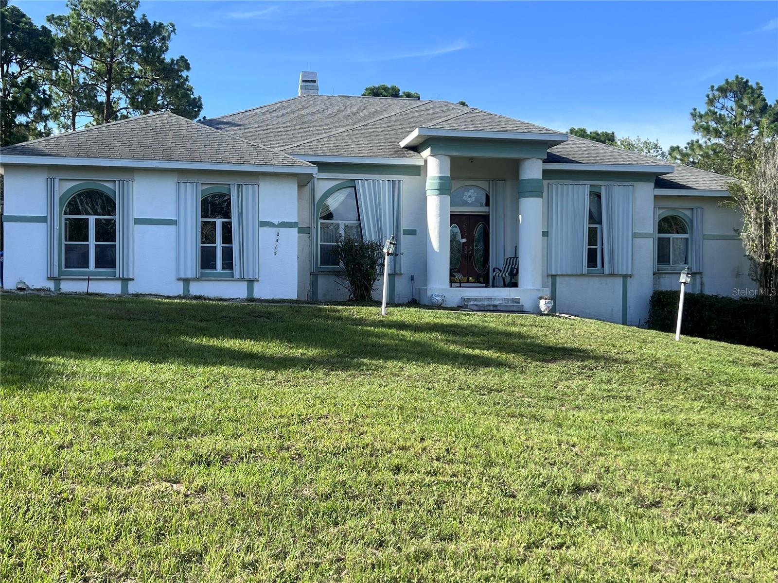 Spacious 5-Bedroom Home on 2 Acres – Endless Potential & Prime Space!
Welcome to your future dream home! This 5-bedroom, 3 full bath, and 2 half bath residence offers 3,548 sq ft of living space and sits on an incredible 2-acre lot—providing the privacy and space you’ve been searching for.
Built in 1999, this home features soaring high ceilings, ceiling fans throughout, and a layout designed for both comfort and functionality. The main living areas are generously sized, ideal for entertaining or relaxing with family.
While the roof, AC, and water heater are original, the home has great bones and is priced accordingly ready for your updates and personal touches. The covered lanai with an outdoor kitchen area adds even more potential, perfect for creating your ideal backyard retreat.
Whether you're looking to invest, update, or simply enjoy a spacious home with land, this property offers an unbeatable opportunity. With a little TLC, it can truly shine!
Key Features:
5 Bedrooms | 3 Full Baths | 2 Half Baths
3,548 Sq Ft of Living Space
High Ceilings with Ceiling Fans
Covered Lanai with Outdoor Kitchen Area
2-Acre Lot with Room to Expand or Customize
Original Roof, AC, and Water Heater – Priced Accordingly
Don’t miss the chance to turn this spacious property into the home of your dreams!