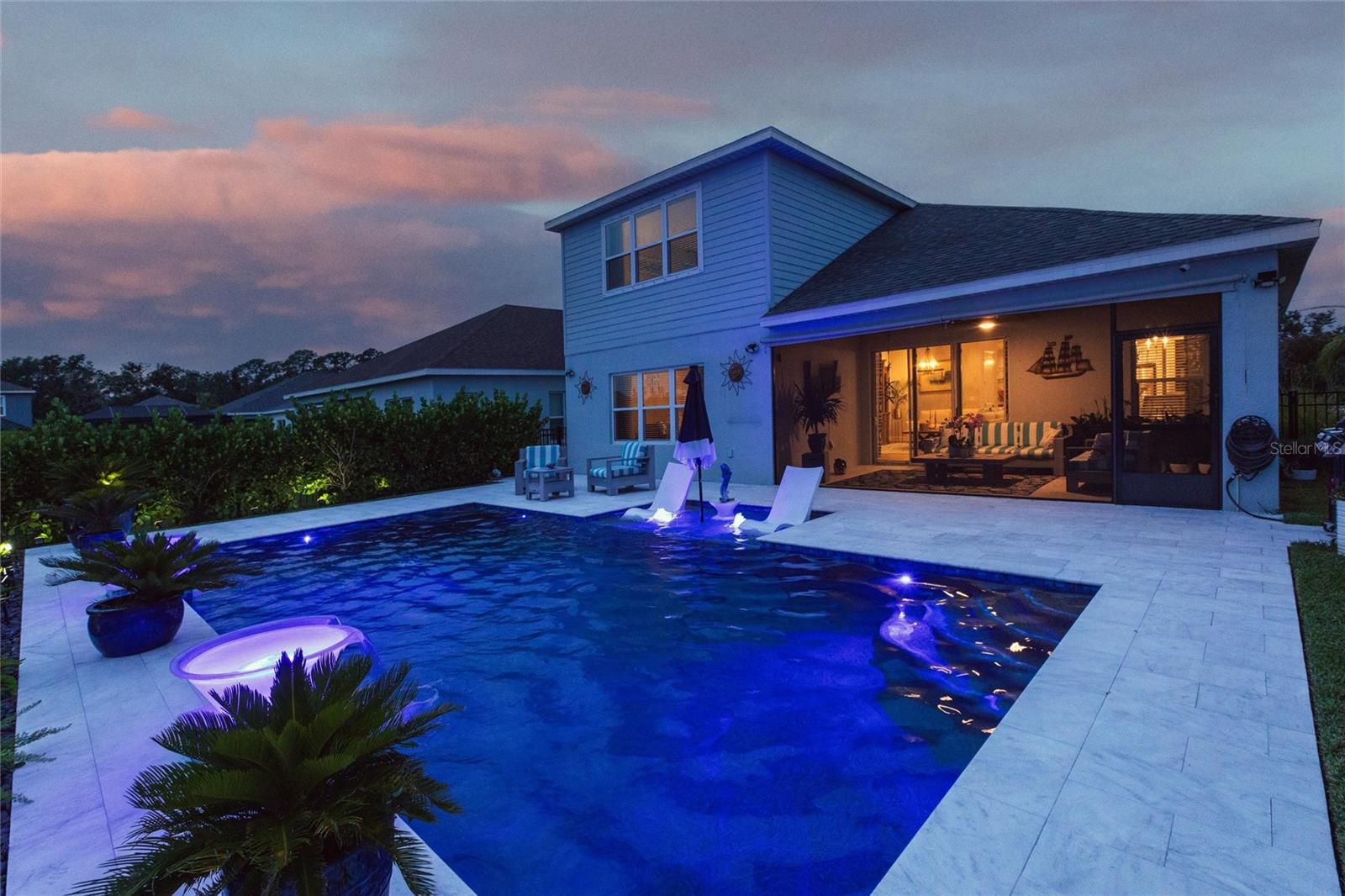 Welcome to your dream home in this stunning 2-story, 2023-built, 4-bedroom, 4-bathroom, office/den, bonus room, waterfront gem. Perfectly blending modern elegance with serene views, this home is designed for both relaxation and entertainment. The kitchen features sleek Corian countertops, stainless steel appliances, abundant cabinetry, and a center island with a breakfast bar. There are two walk-in pantries to give you tons of storage. A versatile den offers flexibility as a home office, study, or guest room. The luxurious primary suite is a true retreat, boasting a walk-in closet, dual sinks, and a spa-like glass-enclosed shower. Two more bedrooms and a well-appointed full bathroom ensure comfort for family or guests. The second floor features an added bedroom, full bathroom, and a large bonus, media, of flex space. Let us go outside to your private oasis! The expansive backyard features a sparkling saltwater pool, open to the natural beauty of this space. Beautifully landscaped grounds, perfect for barbecues, entertaining or quiet evenings under the stars. Silverleaf is conveniently situated near I-75 and I-275, providing easy access to Tampa, St. Petersburg, and Sarasota. Silverleaf’s amenities include a resort-style pool, fitness center, clubhouse with catering kitchen, dog parks, playgrounds, walking trails, and flex lawn space. For those with a penchant for shopping and dining, Silverleaf is a prime location near a wealth of premium options. Additionally, golf enthusiasts will revel in proximity to world-class courses such as the River Wilderness Golf and Country Club and the Buffalo Creek Golf Course. Call today for a private showing of this beautiful home.