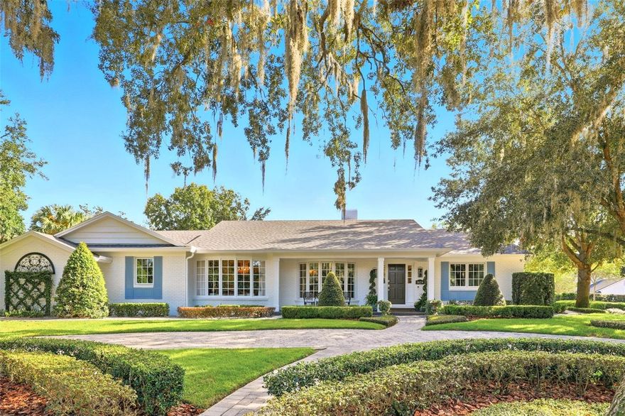 Totally traditional. This luxury single-story home is in the desirable Sevilla neighborhood in Winter Park. Sitting high and dry on approximately a half-acre, beautifully landscaped lot.  Original home was gutted down to the studs in 2011-2012 and completely re-done. Interior layout boasts formal living with bay window and tall ceilings, dining room with antiqued mirror set into extensive moldings and trim, plus a library/den with a tongue and groove wood vaulted ceiling and a wall of bookshelves and built-ins. The spacious family room with a white-washed brick wall, wood-burning fireplace and vaulted ceiling is all open to the breakfast area and kitchen. The gourmet kitchen features custom inset cabinet drawers and doors, white marble slab backsplashes, Kohler farmhouse sink and a large island with a deep prep sink. The kitchen is a chef’s delight with a 48-inch Viking gas range, Viking warming drawer, JennAir refrigerator, wine refrigerator and a Bosch dishwasher. The kitchen also has amazing storage and two large pantries. There are a total of three bedrooms (one of which is in the in-law suite) and three full baths. Throughout the home are beautiful real ¾-inch-thick and 5-inch-wide plank walnut floors, beam and coffered ceilings, French doors, oversized picture windows and designer accents lighting. French doors off the family room open to seamlessly blend indoor and outdoor living, leading to a covered lanai with travertine stone tile overlooking a resort and entertaining backyard. Huge swimming pool and a 30-by-15-foot pergola with Bistro lighting, which is a wonderful spot to relax, dine and play, all on a tiny pebble surface, like an Italian driveway! French garden fountain, rose garden and synthetic turf for pets make the backyard a haven. The home’s floor plan offers a desirable layout with huge primary bedroom with a generously sized en-suite bath with dual sink counters, amazing Roman walk-in shower, jetted tub with bubblers and two large walk-in closets. Guest wing features a spacious bedroom and bath and the West Wing is a full In-law apartment, including a bedroom, handicapped bath, full kitchen and its living room. Imagine having a wonderful space for in-laws or an adult family member that needs space of their own. Just a short drive or bike ride from Park Avenue, this open and inviting home has easy access to Park Avenue, AdventHealth, downtown Orlando and is zoned for A-rated schools. Surround sound through most of the house and CAT 6 wiring throughout. Recent additional remodeling and updating have taken place including all new paint inside and out, as well as a new roof and gutters in 2023. A detailed list of all renovations is available upon request.