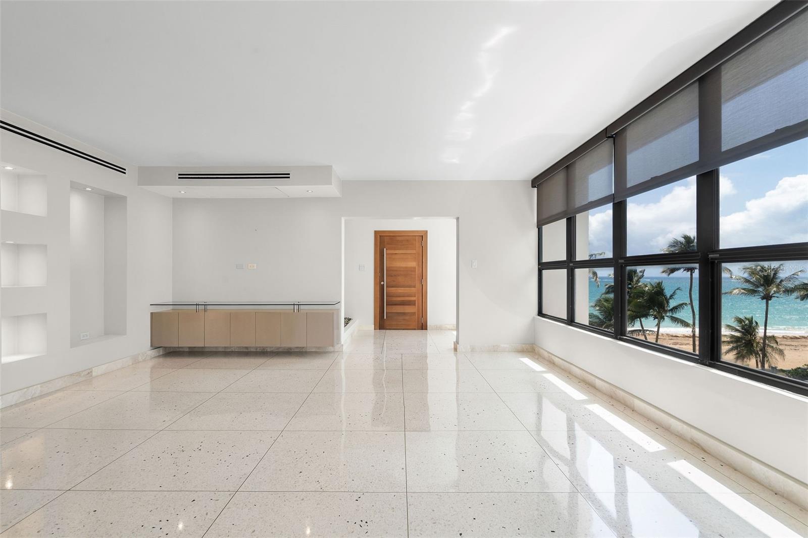 Perfectly situated next to Borinquen Park (Parque del Indio) and Kings Court Beach in one of Condado’s most desirable residential areas, this approximately 1,975 sq. ft. fully remodeled residence at Park Terrace Condominium offers impeccably designed living spaces with generous proportions, light-filled open rooms, and exquisite finishes, complemented by beautiful partial ocean views.
The open-concept great room features an elegant living area, inviting dining room, and a versatile home office/family room. A fully equipped gourmet eat-in kitchen makes everyday living and entertaining a delight. The home includes three bedrooms, including a spacious primary suite with walk-in closet, two full bathrooms, one powder bath, a dedicated laundry room, and two parking spaces: one enclosed garage with storage potential and one open space.
This boutique condominium offers direct beach access, a full backup generator, security, and a water cistern. The building underwent a major renovation, including a new lobby, visitor parking, and upgraded security guard facilities, among others.
Located just one block from St. John’s and Robinson Schools, and steps from parks, fine dining, shopping, hotels and medical facilities. Enjoy a vibrant neighborhood with proximity to Ocean Park, Miramar, Old San Juan, and the San Juan International Airport.
Experience the best of urban coastal living in Condado, schedule your private viewing today.