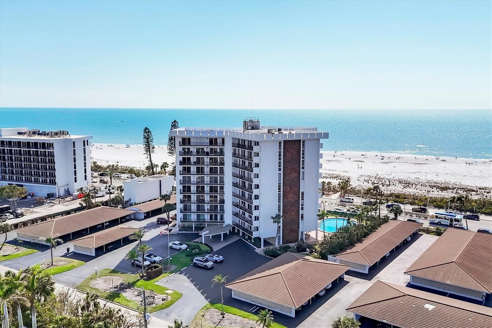 This Gulf-front condo, located on the desirable Lido Key, offers breathtaking views of the beach and the crystal-clear waters of the Gulf. Just a short stroll from the iconic St. Armands Circle, this 2-bedroom, 2-bathroom residence is fully furnished and ready for you to move in. Enjoy unobstructed water views from every room, with neutral tile flooring running throughout the 1,275 sqft of living space. The condo features ample storage for all your beach essentials, and the expansive 240 sqft porch is perfect for relaxing with plenty of space for outdoor furniture while watching spectacular sunsets over the Gulf. Additional highlights include hurricane shutters, a storage locker conveniently located in front of your parking spot, and the added luxury of electric shades throughout the condo, offering both comfort and convenience at the touch of a button. The building has undergone extensive renovations, including updates to the lobby, community room, kitchen, library, bathrooms, gym, re-lined plumbing, and a resurfaced heated pool. On-site maintenance management ensures convenience and peace of mind. To top it off, this building is fully funded and had no storm issues! The location is unbeatable—just minutes from the Lido Beach Tiki Hut/Bar, perfect for enjoying sunsets, meals, and drinks. Further south, explore a nature preserve park offering kayaking, paddleboarding, and fishing. St. Armands Circle, with its renowned restaurants and shopping, is within walking distance, and downtown Sarasota, featuring theaters, opera, boutiques, and fine dining, is just a short drive over the Ringling Bridge. Plus, 1 pet up to 25 lbs. is welcome. Don’t miss out on this incredible opportunity to own a piece of paradise that has it all!