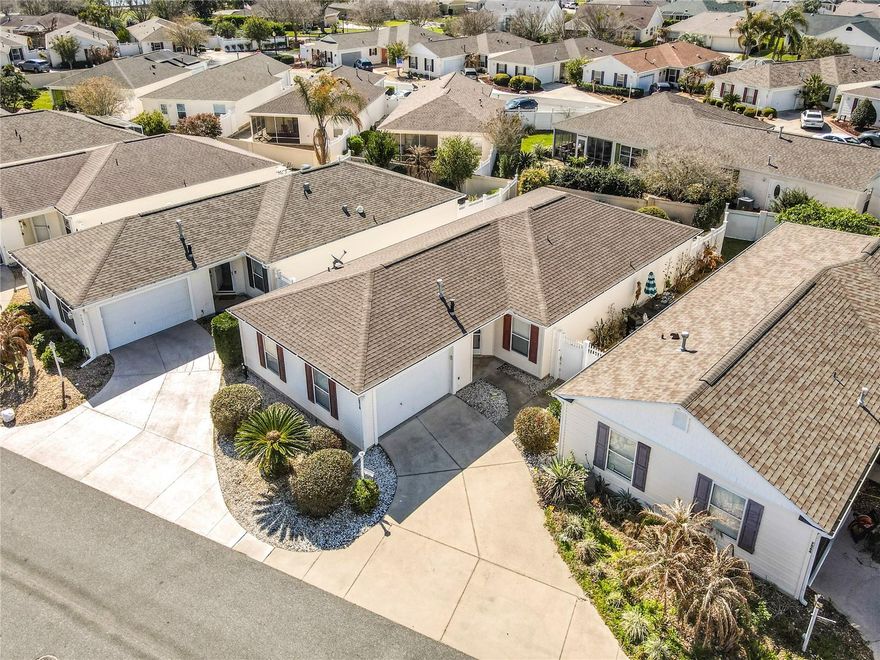 Welcome to your new home, where comfort meets an active lifestyle in the vibrant community of The Villages. This charming Furnished 2-bedroom, 2-bath Amelia model courtyard villa, located in the desirable Calumet Grove, is perfectly positioned just moments away from the First Responders Recreation Center and the bustling Mulberry Plaza. Delight in the proximity to the Nancy Lopez Country Club, where you're surrounded by lush golf courses and numerous amenities that cater to every retiree's desires. As you enter through the inviting foyer, you'll be guided seamlessly through this well-appointed  NO CARPET home. The recently remodeled kitchen features elegant decorative panel white cabinets, sleek granite countertops, and a tasteful tile backsplash. The open pass-through window connects the kitchen to the living space, creating an inviting environment for both cooking and entertaining. There's also ample room for dining in the kitchen, alongside a handy pantry closet, and the convenience of a gas stove. The front bedroom serves as a comfortable retreat with the added benefit of an en suite guest bathroom, enhancing convenience and functionality. Both bedrooms offer ample natural light and are versatile, featuring the guest bathroom with a stylish Corian countertop. The living area is an oasis of openness, as it seamlessly integrates with the dining room, exuding a warm and welcoming ambiance. The ceilings have been modernized for a sleek appearance, and the space is bathed in natural light, accented by custom cornices over the windows and slider doors. The expansive primary bedroom, offers an abundance of space and comfort. The adjoining bathroom is thoughtfully equipped with a Corian counter, glass-enclosed shower, and a lovely vanity area for all your grooming needs. Out onto the serene exterior lanai, screened for comfort and tranquility, you will notice a low-maintenance rocked rear courtyard—ideal for enjoying Florida's beautiful weather in privacy. For your peace of mind, the home features a NEW ROOF installed in 2022. Additionally, the BOND has been fully PAID off, offering significant savings. The garage is designed to accommodate both a car and a golf cart, with a painted floor that enhances its functionality and appeal. Embrace the endless possibilities of leisure and social activities offered in this thriving 55+ community. Welcome home to a vibrant and fulfilling retirement lifestyle in The Villages.