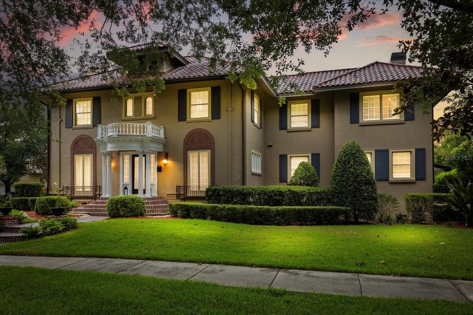 Step into timeless elegance with this gorgeous 1925 estate home located on a charming brick-lined street in the highly sought-after Lake Cherokee District. Featuring 5 bedrooms, 4.5 bathrooms, and nearly 3,600 square feet of living space, this character-filled home includes a detached 1,009 SF guest house, a resort-style pool, and countless high-end upgrades throughout. The main home showcases a seamless blend of historic charm and modern luxury with formal living and dining rooms, hardwood floors, high ceilings, and both gas and wood-burning fireplaces. The chef's kitchen is a standout, featuring marble countertops, a commercial-grade 8-burner dual oven gas range, Miele coffee system with external milk container and cup drawer, glass rinser, pasta arm, and two full refrigerators. Upstairs, the primary suite offers a spacious sitting area, renovated en suite bath with dual vanities, walk-in shower, and multiple closets. Three additional bedrooms and two full baths complete the second floor, along with access to a laundry chute, floored attic, and fully insulated attic and crawlspace with closed-cell foam. Downstairs also includes a private office/den, half bath, and a basement equipped with a top-of-the-line sump pump, offering both function and peace of mind—especially since the home sits well above the flood line and has remained untouched by past flooding. Step outside into a true backyard oasis featuring a resort-style pool with water jets, a solar-heated outdoor shower, brand new pool pump, light, and filter, two covered lanais, and a generous fenced-in yard. The property also includes smart solar exterior lighting with customizable seasonal presets, a pool storage room, and an additional storage room at the rear of the home. The detached guest house offers privacy and flexibility with a bedroom, full bathroom, kitchenette, and living area—ideal for visitors, extended family, or rental potential. Additional upgrades include rain showers in all bathrooms, granite counters throughout, and a washer/dryer set with steam, shoe-wash, and dry-cleaning features.Zoned for top-rated Blankner K-8 and Boone High School, this exceptional home is located just minutes from Downtown Orlando, Waterford Lakes, UCF, Orlando International Airport (MCO), and major roads including E Colonial Dr and the 408. This is a rare opportunity to own a piece of Orlando history with every modern convenience.