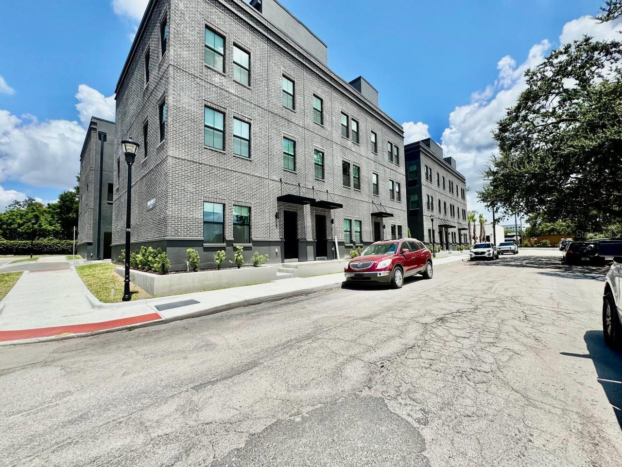 Canvas GWX is an urban-living experience like no other, an industrial-chic city home set in the heart of vibrant Ybor City. Designed to reflect the area's rich history, these homes draw influence from the iconic brick cigar factories and converted warehouses that now pulse with creativity, co-working spaces, and some of Tampas best restaurants and nightlife. Enjoy a private street-level entrance, an attached two-car garage, and expansive rooftop terrace with jaw-dropping views of downtown Tampa, Ybor City, and the skyline beyond. Inside, the vibe is unmistakably modern with an artistic edge. Nearly 10-foot ceilings, exposed block concrete walls, and large windows fill the space with natural light creating the perfect backdrop for your personal gallery or creative flair. The ground floor features polished concrete floors, a stylish ensuite bed-and-bath combo ideal for guests or a home office, and direct garage access. Upstairs, the second floor opens to a loft-style living area with industrial-modern finishes, high ceilings, and a statement-making kitchen complete with a massive island perfect for hosting, cooking, or crafting cocktails. On the third floor, the owners suite is your personal sanctuary, offering a walk-in closet roomy enough for an extensive wardrobe or sneaker collection, plus a spa-like bath that balances form and function. Beyond your front door, Ybor City invites you to live at the intersection of culture and convenience. Step into the lively nightlife scene, catch the streetcar to downtown or Water Street, see a concert at Amalie Arena, or indulge in Sparkman Wharfs foodie paradise. Bike to Armature Works, stroll the Riverwalk, or take in a show at the Straz Center. In addition to the advertised base rent, all residents are enrolled in the Resident Benefits Package (RBP) for $50.00/month which includes HVAC air filter delivery, credit building to help boost your credit score with timely rent payments, utility concierge service making utility connection a breeze during your move-in, and much more! More details upon application. One pet welcome, 40 lbs. Vacant and Available now!