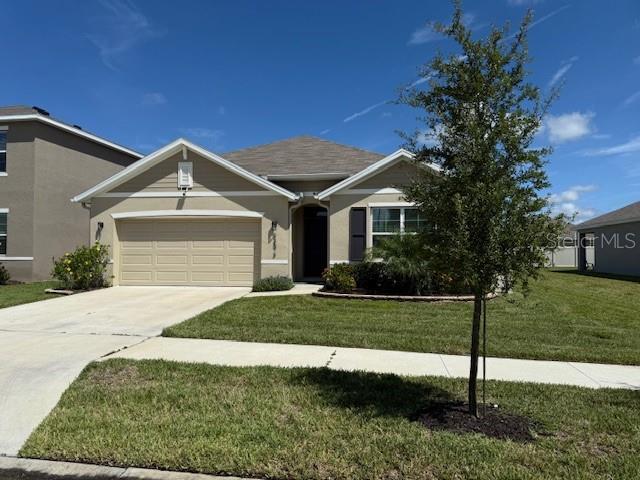 No Expense Spared on This Nearly New Wesley Chapel Gem!!!
Welcome to Avalon Park West, one of Wesley Chapel’s most desirable communities! Enjoy resort-style amenities including sparkling pools, top-notch playgrounds, beautiful clubhouses, and even a walkable elementary school—perfect for today’s active families.
This 4-bedroom, 2-bathroom smart home is just 2 years old and packed with upgrades. With a 2-year-old water softener and built-in WiFi-enabled features, convenience and comfort are part of everyday living.
Step inside to a spacious foyer that leads to two bedrooms and a full bath up front, plus an additional bedroom near the large laundry room. Down the hall, the home opens up into a stunning chef’s kitchen with granite countertops, a center island with sink, stainless steel appliances, upgraded lighting, and a walk-in pantry. The open floor plan flows seamlessly into the dining space, oversized family room, and out to a covered lanai overlooking the fenced backyard with plenty of room to play or entertain.
The private owner’s suite features dual vanities, a separate water closet, and an oversized walk-in closet.
Upgrades are everywhere—tile flooring in main areas, modern toggle switches, designer light fixtures, and more. Truly a rare treasure where nothing has been overlooked