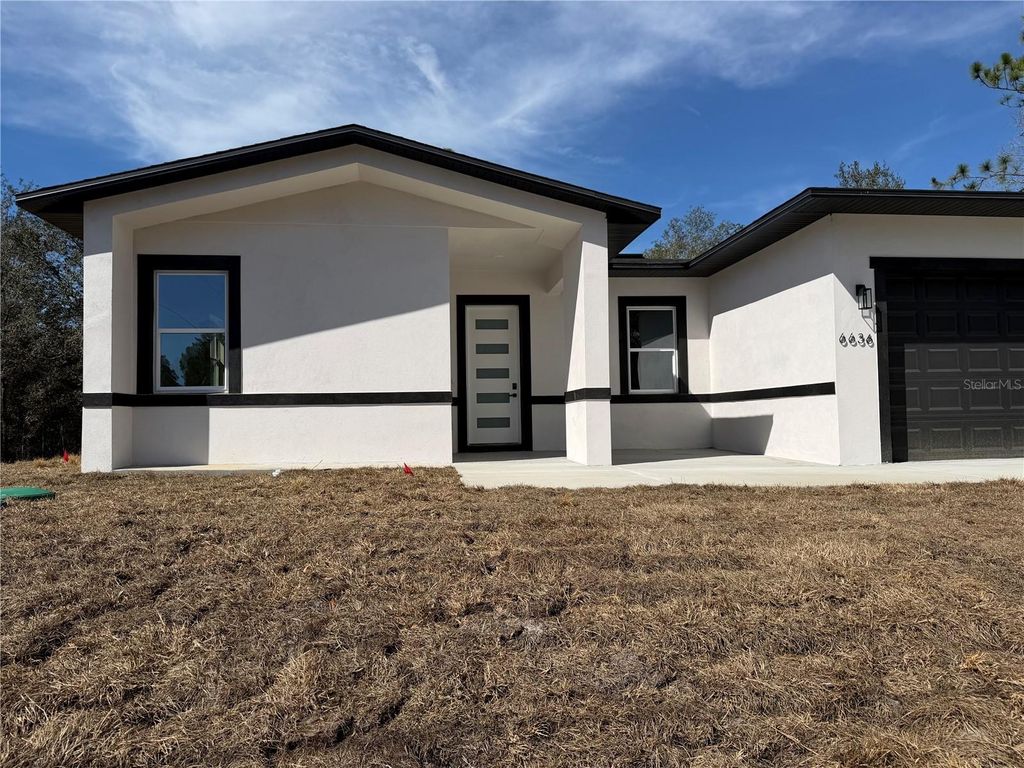 Photo of 6636 N Varsity Ave Dr, Dunnellon, FL 34434 (MLS # O6394388)