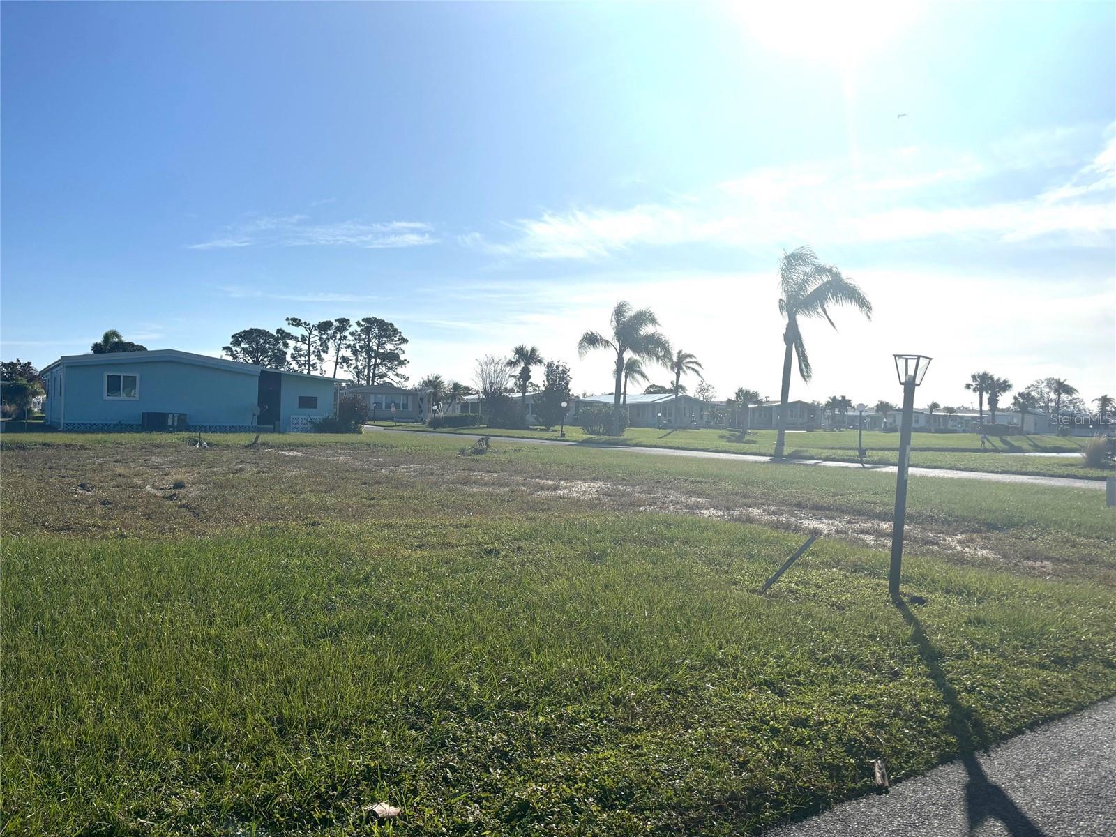 Vacant lot with a view of one of our 8 beautiful lakes. La Casa, a vibrant 55+ community, offers the ultimate Florida lifestyle. We have 974 homes nestled among a variety of native trees with spacious common grounds surrounding our eight lakes. Located between Sarasota and Fort Myers, this is a boater's dream with access to the Gulf of Mexico. It is convenient for shopping, sightseeing, golfing, fishing, and boating, as well as all the culture and elegance the Southwest Florida area is noted for. La Casa may have the best pools in the area. Our crown jewel is an extremely large, 40 X 60-foot swimming pool that is kept at a perfect 87 degrees. Our smaller 20 x 40 pool is quietly nestled between the clubhouse and the Activity Building. Both pools have adjacent hot tubs which are ideal for soaking muscles that are tired from golfing or tennis. Wireless Internet (Wi-Fi) is available at the Clubhouse, Activity Building, and Recreation Hall area where these pools & spas are located, so you can catch some rays while you catch up on your email! Sound enticing? Come for a visit to this self-contained oasis and see for yourself why La Casa is the ultimate destination for both snowbirds and year-round residents!