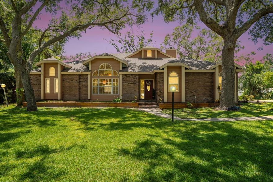 Welcome to this stunning 4-bedroom, 2.5-bath lakefront home, perfectly situated on a quiet cul-de-sac in the serene Ravenwood community. Offering 2,800 sq ft of living space on a private 1+ acre lot, the home features a bright, open layout and a cozy fireplace. Recent upgrades include plush neutral carpeting, granite countertops, modern cabinetry, and updated stainless steel appliances. Enjoy peaceful water views framed by beautiful oak trees from the spacious sunroom, which opens to an open-air patio perfect for grilling and other outdoor activities. Ideally located just 5 minutes to University Town Center Mall, shopping plazas, and top restaurants, and 5 minutes to Longwood Run Park and Benderson Park. Only 10 minutes to downtown Sarasota and 20 minutes to Siesta Key — this home combines comfort, convenience, and Florida charm.