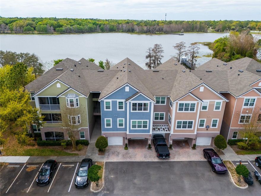 Discover elevated lakefront living in The Hamptons at MetroWest—one of MetroWest’s most lush, amenity-rich gated communities. Perfectly positioned within the neighborhood, this beautifully maintained one-bedroom, one-bath residence showcases a rare, unobstructed panorama of Turkey Lake, paired with serene views of a protected natural reserve—offering a level of privacy, tranquility, and scenic beauty seldom found at this price point. Flooded with natural light, the interior features soaring ceilings and a thoughtfully designed, open layout that feels both spacious and inviting. Stylish vinyl flooring flows throughout, leading into a well-appointed kitchen complete with granite countertops, shaker-style cabinetry, stainless steel appliances, and bar seating—ideal for both casual dining and entertaining. The living area is enhanced by custom-built-ins and sliding glass doors that open to a private screened balcony, where breathtaking lake views and unforgettable sunset skies become part of your everyday lifestyle. The generously sized primary suite offers a peaceful retreat, featuring a walk-in closet and an updated en-suite bath with a modern vanity, tiled shower, and soaking tub. Situated on the second floor for ease and comfort, the residence is just moments from the community pool while still maintaining a quiet, private setting. Brand new AC and 2022 water heater give long term peace of mind. Life at The Hamptons is defined by true resort-style living. Residents enjoy 24-hour gated security, impeccably maintained grounds, and an unmatched collection of amenities—including two lakefront swimming pools and spas, one of MetroWest’s largest fully equipped fitness centers, an elegant clubhouse with business center, indoor sports court, walking trails, dog park, and scenic lakeside dock. On-site conveniences elevate daily living with a neighborhood favorite, Teak Neighborhood Grill, along with a mini-market, salon, and more. Ideally located just minutes from major highways including the Florida Turnpike, top colleges, premier shopping and dining, and world-renowned attractions like Universal Studios Florida, this home offers the perfect blend of comfort, convenience, and lifestyle. Whether you’re seeking a serene personal retreat or a high-demand investment in a prime Orlando location, this exceptional lakeview residence stands apart. Schedule your private showing today and experience the view—and the lifestyle—for yourself.