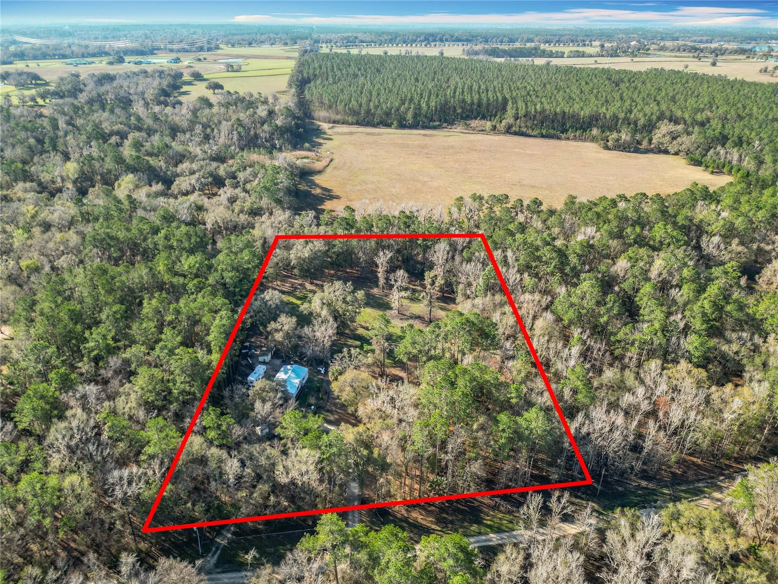 Charming Home on 4.5 Acres with Endless Potential
This spacious 3-bedroom, 2-bathroom home, metal roof, and newer AC unit, built in 2004, sits on a generous 4.5-acre lot with A1 zoning, offering plenty of room to grow and create your perfect haven. While the home could use a little TLC to reach its full potential, the large open space provides endless possibilities for customization. Located in a quiet, peaceful area, this property is perfect for those seeking a tranquil retreat while still having plenty of room for outdoor activities, gardening, horse training, or even additional structures. Make this house your dream home!