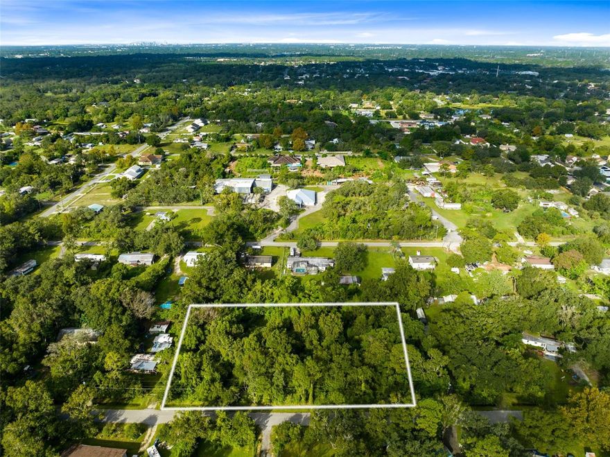 A prime location, this 1.69-acre parcel of vacant land is ideally situated with easy access to major roads such University Blvd., Colonial Drive, and SR 434, making your daily commute a breeze. Zoned as a vacant residential/R-T-2 combo, this property offers versatility, allowing for both mobile home and single-family dwelling options. With ample space, you have the freedom to design a spacious and comfortable living environment that suits your unique needs and desires. This property represents an excellent investment opportunity due to its versatile zoning and strategic location. Whether you plan to build your dream home or explore other real estate opportunities, this parcel is worth considering. Located just a short drive away, you'll find the University of Central Florida (UCF), Waterford Lakes, and a wealth of local shopping and dining options. Enjoy the convenience of having everything you need within easy reach. If you love the beach, this property offers the perfect starting point. Head east for a short drive to visit popular coastal destinations like Cocoa Beach, Cape Canaveral, and Titusville, where you can soak up the sun and enjoy beachfront activities. This vacant land parcel provides the ideal canvas for you to create the lifestyle you've always dreamed of, whether that involves building a dream home or exploring investment opportunities in the thriving real estate market of the area. Don't hesitate to seize this opportunity today!