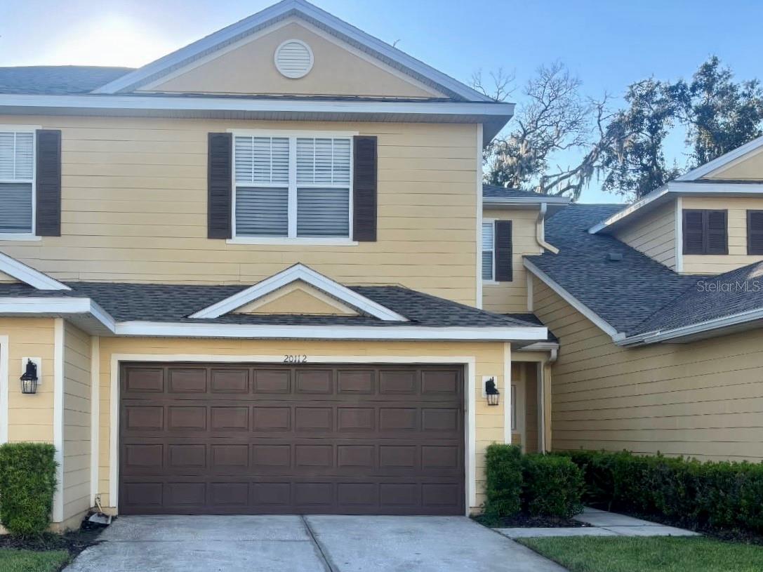 Step into easy Florida living with this 3-bedroom, 2.5-bathroom townhome in the Hammocks. The kitchen is ready for everyday meals or weekend get-togethers with stainless steel appliances, granite countertops, and plenty of space to cook and gather. A 2-car garage gives you extra room for cars, bikes, or storage. Life in the Hammocks is all about comfort and convenience. Spend sunny afternoons at one of the two resort-style pools, stay active in the community gym, and enjoy the peace of living in a gated neighborhood. Shopping, dining, and the Tampa Premium Outlets are just minutes away, as well as top rated schools and major highways. Schedule you showing today before this one is gone!