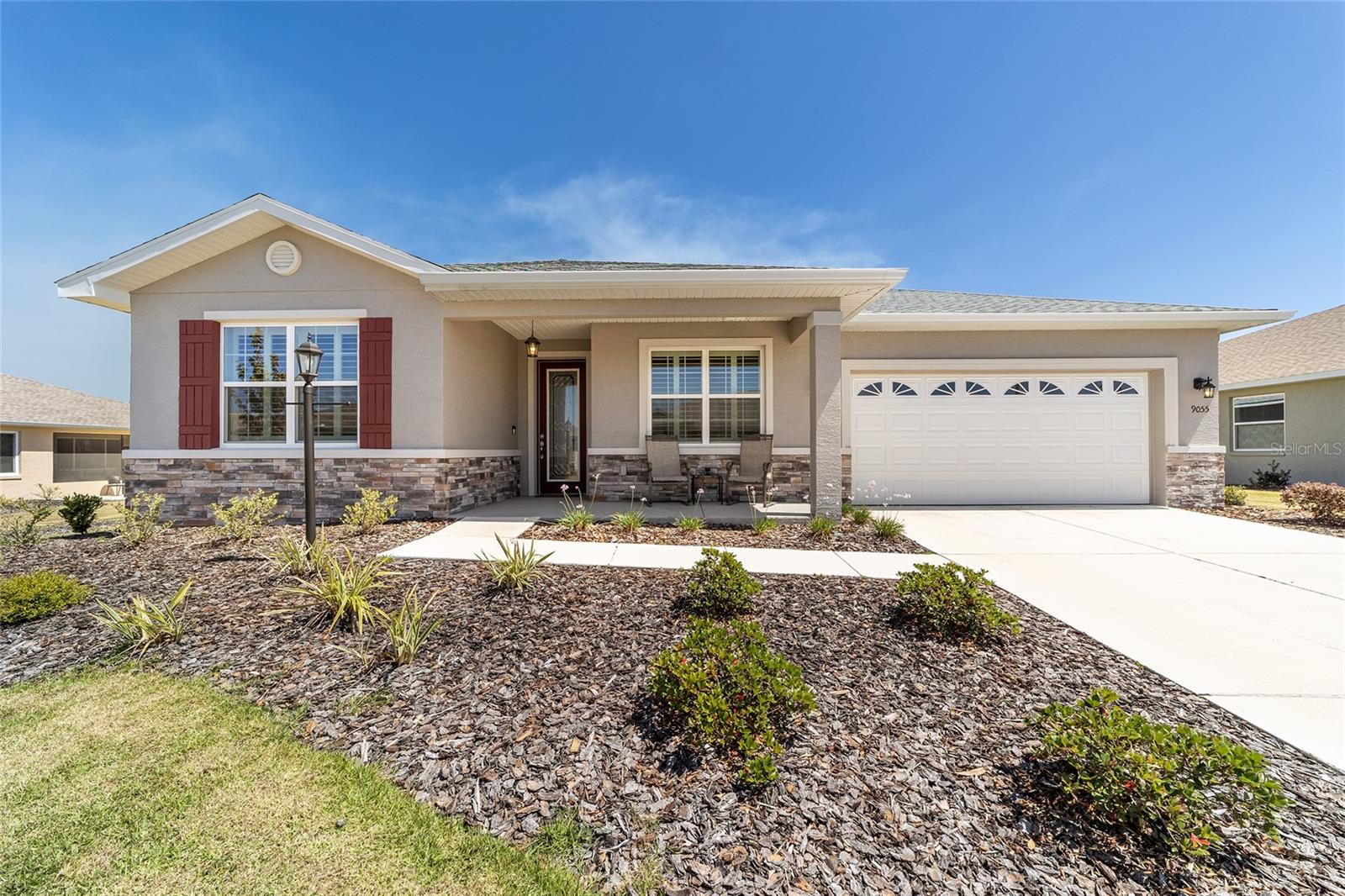 PRIVACY LOT: This 2021 built Ariana located in Avalon 7 in On Top of the World is spacious and loaded with options including luxury vinyl plank in all of the living areas and shutter style blinds. With 2 bedrooms, 2 bathrooms, flex room, and 2 car garage with golf cart parking, this home has a space for everything. The gourmet kitchen has an oversized island, dove grey cabinets, granite counters, stainless steel appliances, subway tile backsplash, and a large pantry. The great room is oversized and has a tray ceiling and a stone fireplace as a stunning focal point. The indoor laundry room has extra cabinets for spillover storage and a sink. Outdoor living is at its finest with an extended, eastern facing lanai that overlooks a heavily wooded privacy area. Avalon 7 is in close proximity to the Arbors indoor and outdoor pools, Bocce Ball, and other amenities. On Top of the World is Ocala's premier, gated, active 55+ community, loaded with amenities and includes golf cart access to three shopping centers.