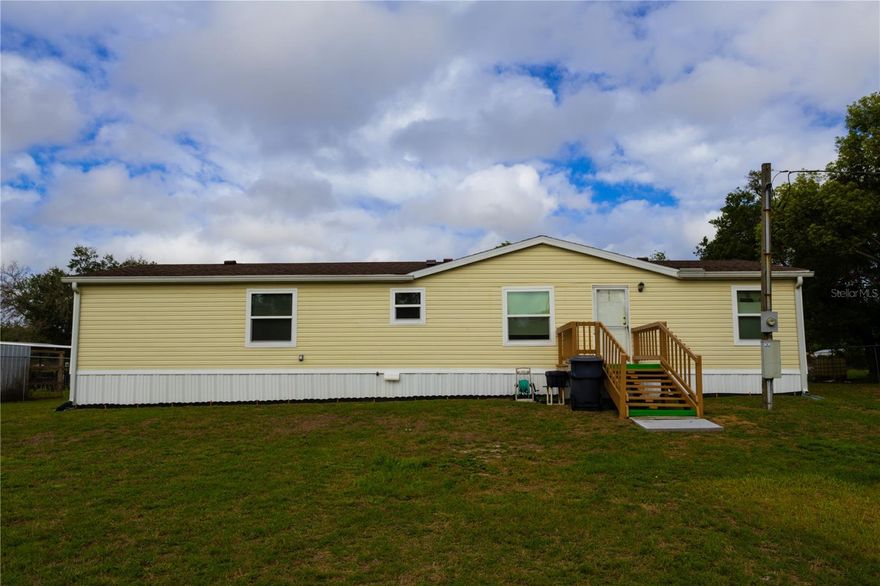 3 BR 2 bath split plan mobile home with apx. 1/2 acre with 5' chain link fence all the way around. On dead end street with no thru traffic. NEW ROOF in 2021. NEW WINDOWS in 2024. Master bedroom bath has double vanity, garden tub, shower, and large walk in closet. Gutters front and rear. 8' x 12' Storage shed.