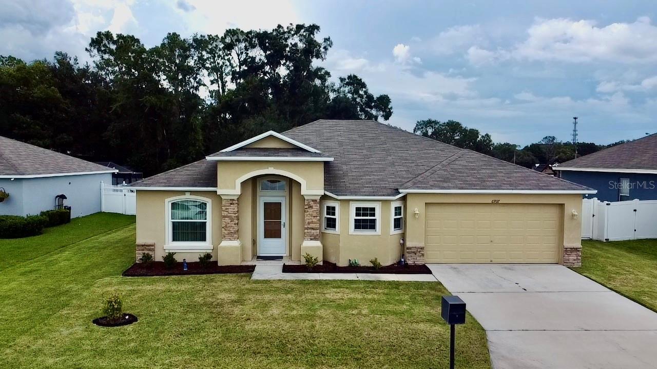 Welcome to the kind of home that’s hard to find—and even harder to forget. This move-in ready property in Lakeland combines comfort, space, and thoughtful upgrades throughout. From the moment you walk in, the natural light and open layout make everything feel warm and inviting. Oversized rooms give you room to breathe, live, and grow.
The kitchen is spacious and fully equipped, with 43-inch upper cabinets, full appliances, and a refrigerator with a top-fridge/bottom-freezer layout that’s as practical as it is seamless. The entire home has ceramic tile flooring—no carpet anywhere—making it fresh, clean, and easy to maintain.
Need space? One of the bedrooms currently fits a king-size bed and two cribs—and still feels open. The bathroom includes both a shower and a tub, offering flexibility for every need.
Outside, the fenced backyard is a true bonus—private, oversized, and complete with a storage shed and a covered, screened lanai where you can unwind or host. Located near everything Lakeland has, this home simply makes sense. Schedule your showing and come experience it in person—it might just feel like home.