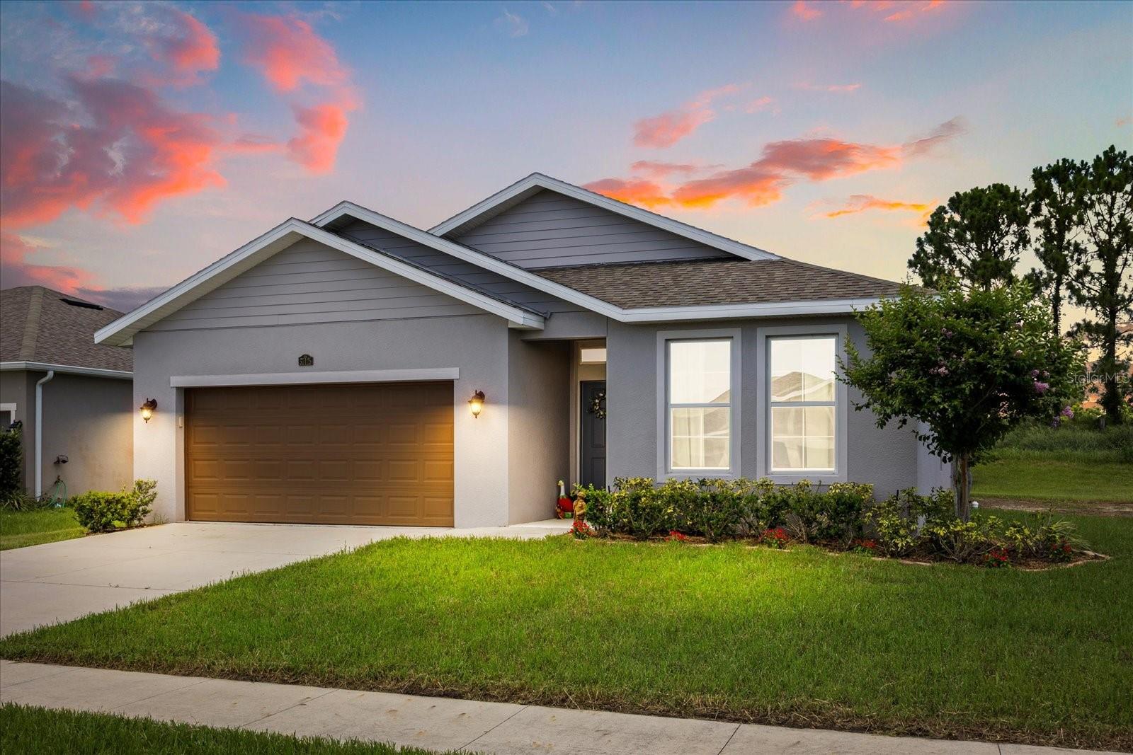 Welcome Home to Windy Ridge! Live comfortably in style in this move-in ready home with all of the upgrades. This 2020 home boasts an open floor plan, stainless steel appliances, granite countertops, and modern tile throughout. The primary bathroom offers a dual sink vanity, full size shower, and walk-in closet. Picture yourself hosting gatherings around the large kitchen island, with plenty of room for guests. Step outside to the lanai, which overlooks a spacious yard, perfect for enjoying a Florida summer day, then cool off at the community pool and playground, located just steps from the house. With a low HOA fee, this desirable and well-maintained community is a hidden gem, minutes from Mount Dora, Eustis, and Tavares. Call today for a showing!