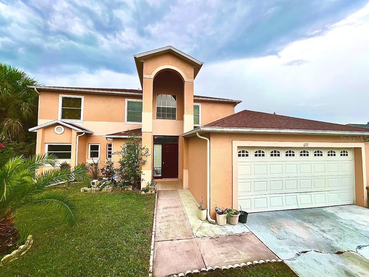 Great Bonus in a Great A Neighborhood! This Charming 4-bedroom, 3 bath, 2 story home is ready for it's next chapter. The inviting floor plan offers the primary suite on the main level, complete with a lovely en-suite for comfort and privacy. Enjoy an eat-in kitchen for casual meals, a formal dinning room for special occasions, and grand 2-story living room that's perfect for the holidays. Grab a drink and relax in the enclosed Florida room, ideal as an office, craft room, or simply a sunny retreat. Upstairs, you'll find three additional bedrooms and a full bath, offering plenty of space for family, guest or hobbies. Outdoors, the backyard is a true Gem with avocado and mango trees, and the side yard provides the perfect spot to add a refreshing pool. Nestled in a sought-after neighborhood, you'll be closed to dinning, and all Orlando's world-class attractions. With its solid structure layout, this home is just waiting for your personal touch to make it yours.