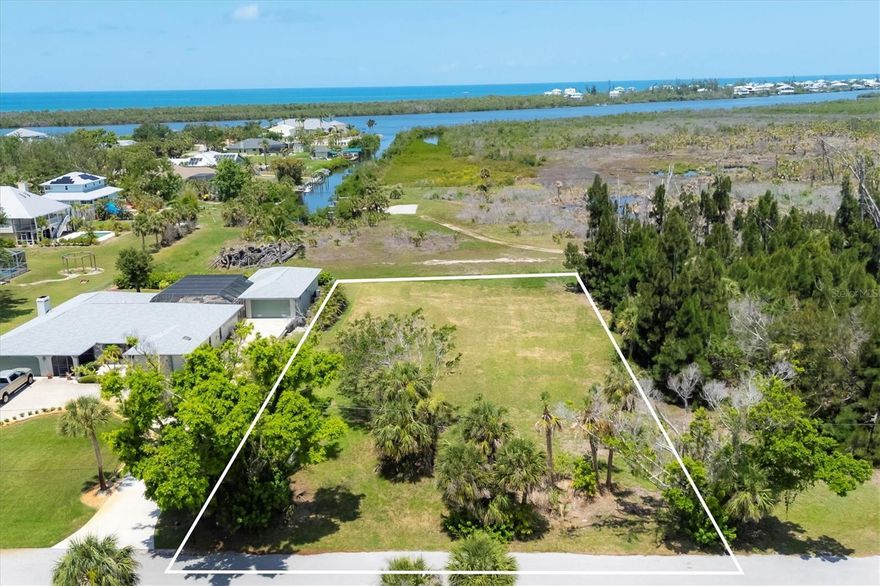 Fantastic large vacant homesite in the historic Vanderbilt developed neighborhood of Cape Haze. On a quiet street that backs up to the serene Don Pedro State Park. At over .55 acres you have all the room to build a tropical retreat of almost any size. There are no restrictions on when you need to build and no restrictions on what style home you can build. The neighborhood offers a variety of classic vintage Florida homes, newer construction properties, and mega-mansion waterfront estates. Stroll the banyan lined streets, bicycle or golf cart to nearby shopping and restaurants on the large sidewalk along Placida Rd. The property is only minutes to historic Boca Grande, three full service marinas, public and private golf courses, miles of tranquil sandy beaches and world-class fishing and boating.