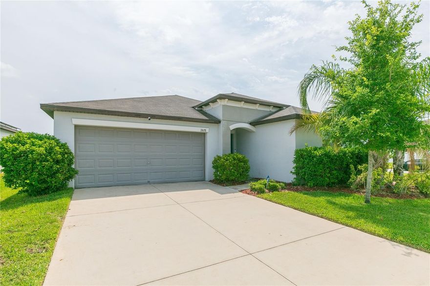 Built in 2020 and exceptionally maintained, this spacious 4-bedroom, 2-bath home offers 1,936 sq. ft. of comfortable living on an oversized corner lot measuring nearly a quarter acre—a rare find in Riverview. The property also includes fully installed solar panels, providing long-term energy savings, reduced monthly utility costs, and increased efficiency for everyday living. Inside, the open-concept layout is designed for both function and flow. The kitchen features a center island overlooking the café and family room, creating an ideal space for gatherings and entertaining. Upgrades include 36" staggered Chatham Umber cabinetry, onyx GE® appliances, Ink Vesta granite-look laminate countertops, and 18x18 Tesola Taupe ceramic tile throughout the main living areas. The private owner’s suite offers a spacious bedroom, dual sinks, a large walk-in closet, and a well-appointed bathroom. Three additional bedrooms provide flexibility for guests, work-from-home needs, or hobbies. Located just south of Tampa, this community blends suburban comfort with convenient access to shopping, dining, and entertainment. Neighborhood amenities include a basketball court and sports court, offering outdoor recreation close to home. This move-in-ready property combines modern construction, energy-efficient solar power, and an exceptional lot—an outstanding opportunity in Riverview.