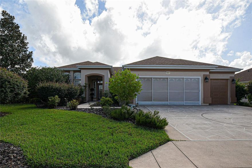 Discover your dream home in this exquisite 1936 sq. ft. Sanibel model sanctuary, where every detail has been thoughtfully curated to enhance your daily life. As you step into the inviting living room, you're greeted by warm, rich hardwood floors and a flood of natural light from large windows, creating an atmosphere of openness and tranquility. Plus, a beautiful glass entry door leading to an inviting foyer.

The heart of this home is the beautifully appointed kitchen, featuring sleek stainless-steel appliances, elegant granite countertops, and crisp bisque cabinetry. This culinary haven is perfect for both everyday meals and entertaining guests, with ample space to unleash your inner chef.  High ceilings and beautiful arched windows enhance the dining area.

Retreat to the luxurious primary bedroom, a spacious 270 sq. ft. oasis designed for ultimate relaxation. The en-suite bathroom boasts a indulgent soaking tub and a separate shower, providing a spa-like experience in the comfort of your own home.

For those who work from home, can the 3rd bedroom can be used as a den. The second bedroom is extended in size and provides versatility, easily transforming into a guest room or hobby space to suit your lifestyle needs.

Throughout the home, stylish ceiling fans and carefully chosen light fixtures add both functionality and flair. Features include crown molding, Plantation shutters and more.  The harmonious blend of warm and cool tones in the decor creates a welcoming ambiance that will make you feel instantly at home.

Outside, lush greenery beckons through the windows, promising serene views and a connection to nature. This property isn't just a house; it's a canvas for your dreams, a place where memories are made, and a testament to your success. The enlarged lanai is great for relaxing and back yard is deep and semi-private.  

The garage is extended and has a golf cart garage that is enclosed and can be utilized as a large workshop or extra storage. Roof was re-shingled in 2021.  HVAC new in 11/2017.  Roomy inside laundry with extra cabinets.

Embrace the lifestyle you've always desired in this thoughtfully designed, move-in ready home that perfectly balances comfort, style, and functionality.
