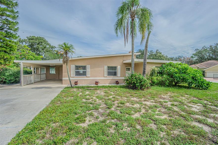 Stunning Corner Lot Home with pool in Tarpon Springs! Welcome to your dream home! This beautifully renovated four-bedroom, two-bathroom residence is perfectly situated on a spacious 20,000 sq. ft. corner lot, offering both privacy and plenty of outdoor space. As you step in inside, you'll be greeted by a bright and inviting open floor plan that seamlessly blends elegance and comfort. The heart of this home is the gourmet kitchen, featuring exquisite wood shaker cabinets and luxurious granite countertops, perfect for both casual family meals and entertaining guests. The thoughtful tri split floor plan allows for your master en suite to be a private retreat on the right side of the home next to two additional bedrooms, while your fourth bedroom is conveniently located on the opposite side of the home ensuring privacy, comfort and space for everyone. Step outside to your personal paradise, where a stunning pool awaits, surrounded by lush landscaping- ideal for relaxation and summer gatherings. Located just minutes from the world famous sponge docks of Tarpon Springs, you'll enjoy easy access to charming boutiques, grocery shopping, and delightful eateries. Nature lovers will appreciate the proximity to Fred Howard Park and Dunedin Causeway, perfect for beach days and adventures. Families will love the convenience of being close to Tarpon Springs Middle School, Tarpon Springs High School, and Sunset Hills Elementary School, as well as the nearby Riverside soccer field, offering tennis, basketball, and various sports activities. Properties of this size and caliber are a rare find in Tarpon Springs. Don't miss your chance to own this incredible home-move-in ready and waiting for you to create lasting memories! Schedule a showing today!