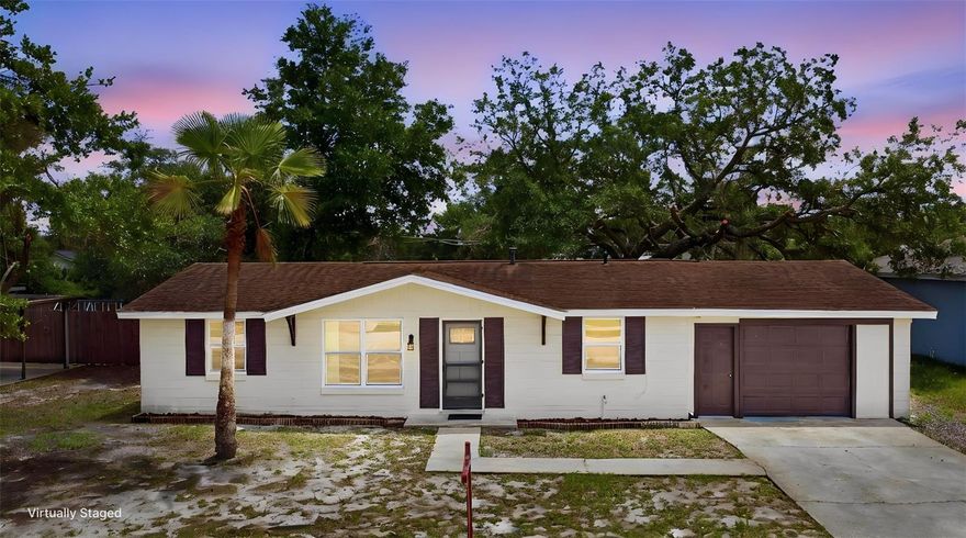 One or more photo(s) has been virtually staged. Welcome to this move-in ready 2-bedroom, 2-bath home located in the heart of Deltona, offering convenient access to Interstate 4 for easy commuting to Orlando, Sanford, and Daytona Beach. Recent updates include a BRAND-NEW gas water heater, updated electric panel, new carpet in the bedrooms, smart kitchen appliances, fresh interior paint all completed in 2026, and a BRAND-NEW ROOF to be installed prior to closing. The entire kitchen was remodeled in 2024.Updated vinyl windows throughout. Inside, the home features a desirable split floor plan designed for both comfort and privacy. The primary bedroom suite includes a walk-in closet with built-in storage for added convenience and a private bathroom. The cozy kitchen offers modern cabinets and gorgeous butcher block counters, stainless-steel appliances, a smart dishwasher and range, added for extra comfort. All kitchen appliances, along with the washer and dryer located in the  indoor laundry room, convey with the home. Step outside to enjoy the spacious fully fenced backyard, thoughtfully divided into two separate areas. One area offers a grassy space ideal for pets or outdoor play, while the paved enclosed area is perfect for BBQs, entertaining, or relaxing outdoors. The backyard also includes a 14x11 screened porch complete with a convenient doggy door. Public septic and water ensures no surprise septic tank or well replacements.  Ask your Realtor® for the unbranded virtual walking tour. All measurements are approximate and should be independently verified.