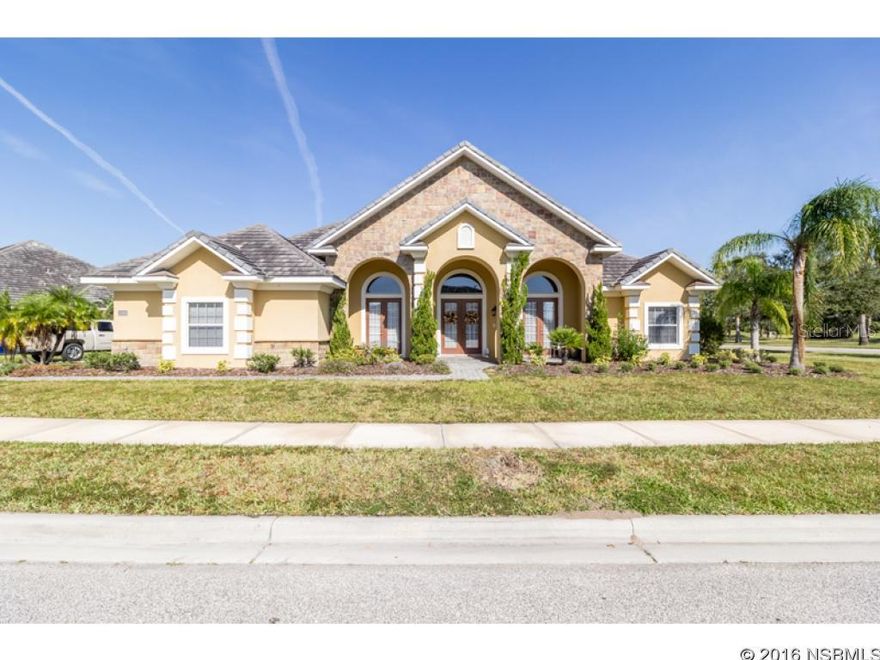 Under contract taking backups. Stunning executive home with lots of style and luxurious finishes! From the stone work on the front of the home to the interior upgrades, this home has a lot to offer. Step through the double door front entry to a spacious foyer with a Formal Living Room to the right and the Formal Dining room to the left, accented by decorative columns and archway that define the space. The open floor plan leads to the kitchen which is the heart of the home & is adjacent to the family room and breakfast nook, creating a great flow for entertaining. Relax in the family room while the cook in your family prepares a wonderful dinner in the gourmet kitchen that features wood cabinets, Granite counter tops, center island, built in desk, pantry, under cabinet lighting and a breakfast bar for additional seating. This beautiful home also has a great Owner's Suite with separate sitting area, 2 large walk-in closets, and access to the screened Lanai. The attached spa-like bath has many amenities you would expect in a high end home such as dual vanities, a large walk-in tiled shower, and a garden tub with arched ceiling and column accents. Three additional bedrooms and two full guest baths give you plenty of room for family or overnight visitors. Relax on the screened lanai while enjoying your morning coffee and a view of the lake. A three car, side-entry garage, brick paved driveway and tile roof add to the beauty of this great family home. Located within minutes to many shopping and dining options, parks, the Daytona International Speedway and just a short ride to the beach! Community amenities include a clubhouse and community pool. Come view this exceptional home today! ;Water: City