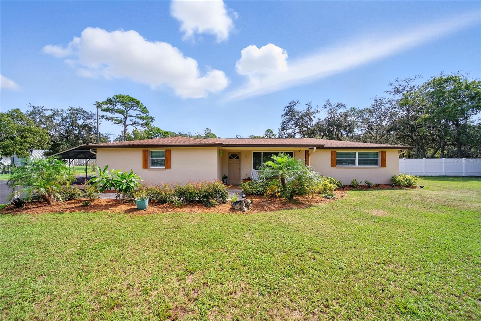 MUST SEE!!! NO HOA OR CDD!! 1.77 ACRES!! This home is LOADED WITH UPGRADES AND PERSONAL TOUCHES and even an Enclosed Swim SPA!!! Looking for a large 4-bedroom home on ACREAGE?? You can get it all with this home: acreage, detached 2 car garage with A/C, 31 x 18 workshop, 22X21 car port, 8x12 storage shed, covered outdoor kitchen area, new partial privacy fence, fenced in yard, water treatment system, new asphalt driveway, outdoor Shower and Sink, pavers and neatly designed walkway, fire pit, gutters, and your own personal outdoor stage for entertainment and parties!! You can even have up to 3 grazing livestock on this property!! This home is ready to go, turnkey with lots of new features. There will be nothing holding you back from this one, home is like new and has been completely updated!! Located in the desirable Tanglewood East neighborhood, which is close to schools, PHS college west, shopping, restaurants, and easy commute to Tampa or the beaches. Put this on your list to see and let's make a deal!