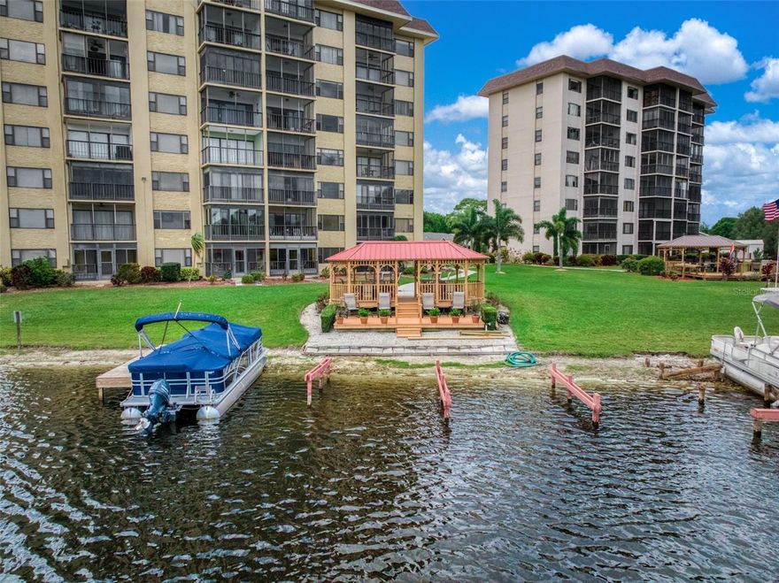 Being sold fully furnished, this well-maintained 2-bedroom, 2-bathroom second-floor condo in Lakeshore Tower One presents a rare opportunity for a move-in-ready lakeside retreat. From the moment you step inside, the space feels bright, open, and inviting, with natural light flowing through the living and dining areas. The home features newer flooring and updated bathrooms, creating a clean and refreshed interior. The living area extends into an enclosed Florida room an ideal space to relax and take in the peaceful views of the 517-acre Lake Grassy. Every detail comes together to create a setting that is easy to enjoy and ready for its next chapter. Residents of Lakeshore Tower One enjoy a low-maintenance lifestyle with amenities including a lakeside gazebo, sun deck, BBQ area, boat slips, elevator access, shared laundry, storage, and covered parking, with HOA conveniences such as water included. Ideally located near local shops, dining, and everything that makes lakeside living so desirable, this condo offers a unique blend of comfort, simplicity, and scenery. Schedule your private showing and experience it for yourself.