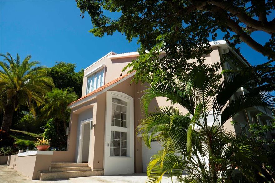 Home features 6 bedrooms, 4 full bathrooms, 1 half bath, and a swimming pool. 2 family rooms, the kitchen opens into the covered terrace, so the cook is always in the action, and has an island that seats 4. The living room faces the pool deck and contains windows that open to an exotic carob tree. The third-floor terrace has beautiful views of the ocean, marina, El Yunque National Rainforest, and two very private sunbathing beds. The garden has a fountain/pond with rustic stone seating which is a great place to relax in the afternoon and listen to nature. This house represents tropical living at its finest. The property includes an extra lot. (2000.37 sqm)

House is rented until February 10, 2022.