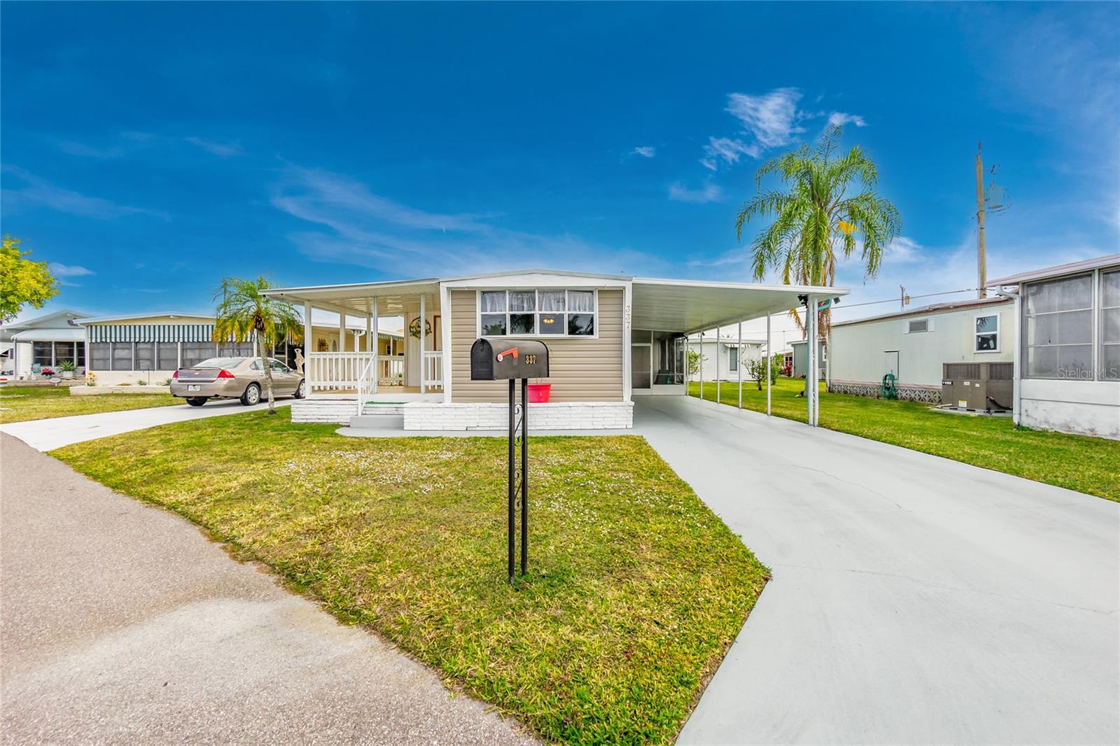 ** Price Reduction ** Discover the vibrant lifestyle of this thriving 55+ community – an active haven for those seeking a dynamic and engaging environment! Situated in a waterfront community with direct access to the Gulf via rentable boat slips on the Myakka River, this is the epitome of Florida living. Indulge in the numerous amenities that make this community truly special. Two sparkling pools, tennis courts, bocce ball, a well-equipped gym, and a woodworking shop are just the beginning. Immerse yourself in a monthly calendar filled with exciting club activities – from the Boat Club, Golf Club to Bingo, A variety of card games, Billiards, and so much more. Nestled on a Pet Friendly street, this charming home welcomes your fur baby (up to 25 pounds) to join the fun. The bright and open concept layout is complemented by updated windows and beautiful new laminate flooring, creating a welcoming space for entertaining and family visits. Convenience meets functionality with an indoor washing machine and dryer. Step outside to your own oasis – a front lanai perfect for evening cocktails or morning coffee, an oversized driveway, and a covered parking lanai area with an extra storage closet. Whether it's parking or entertaining, this space offers versatility and comfort. Rest easy knowing that this home weathered no hurricane damage. The community's prime location puts you just minutes away from historic Venice, the new Wellen Park, the Braves Stadium, pristine Gulf beaches, shopping, and delectable restaurants. Seize this opportunity to live where others vacation – your ideal Florida lifestyle awaits!