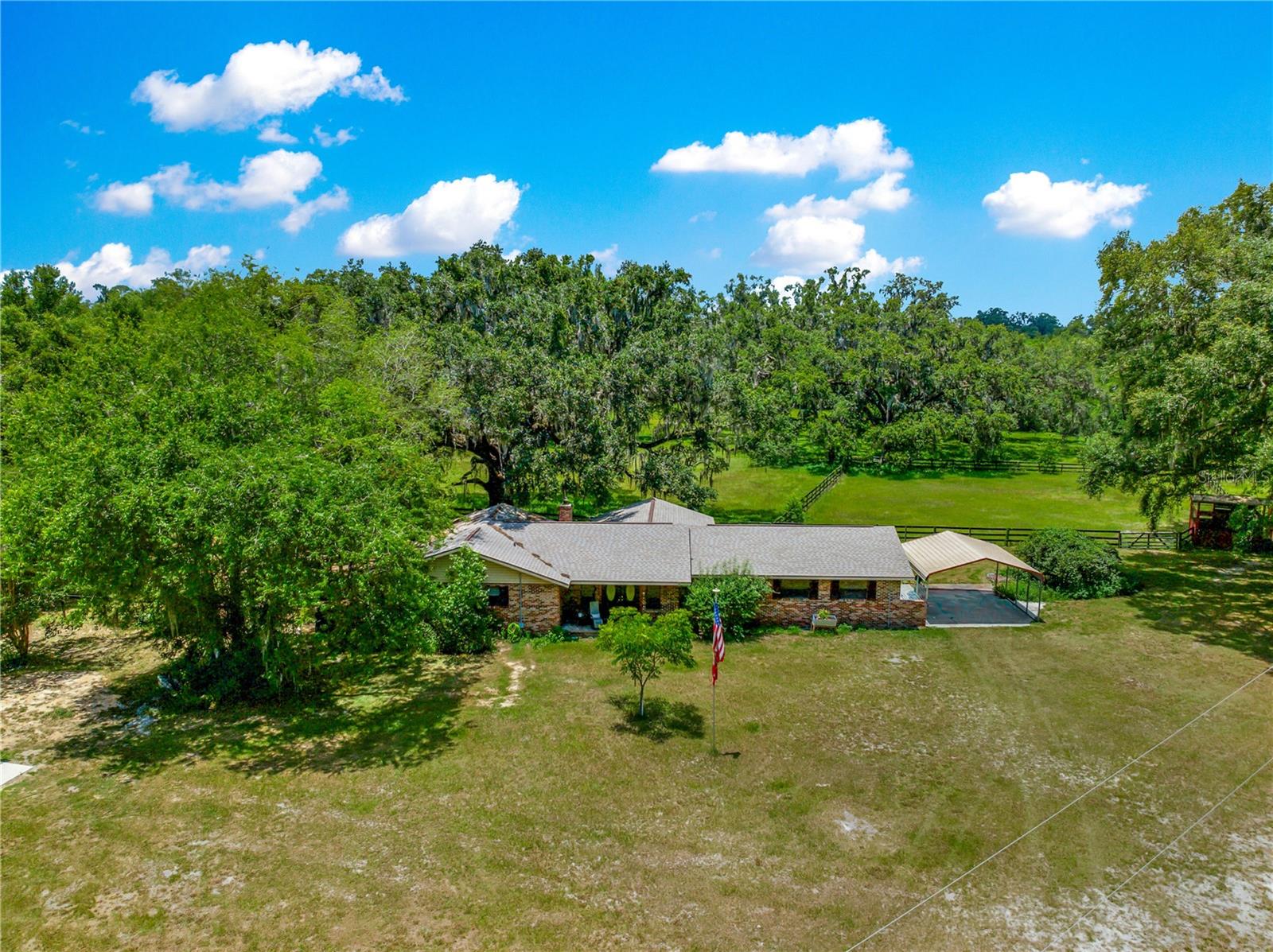 Delightful 3/2 Custom Brick Home in Established, Affordable Equestrian Community
Located just minutes from the World Equestrian Center (WEC), this beautifully maintained
custom brick home offers the perfect blend of equestrian living and comfort. Situated on 5.7
acres—one of the largest mini farms in the community—this property offers sweeping views of
lush Bahia grass paddocks, dotted with majestic live oak trees, providing a truly picturesque
setting.
The home includes over 2,100 sq ft of living space, including a spacious living room with a classic
brick fireplace and an additional family room perfect for relaxation or entertaining. Recent
updates include a brand-new kitchen, a new roof, ensuring worry-free living for
years to come.
Outside, the property features a 1-stall barn with a wash rack and a separate tack & feed room,
ideal for the equestrian enthusiast. Additionally, a 26x36 bonus garage offers ample space for
equipment, a workshop, or even a car enthusiast’s dream space.
Whether you're looking for a winter retreat or a full-time residence, this property offers the
perfect balance of peaceful privacy, equine amenities, and proximity to the WEC. With ample
space for trail riding and all your equestrian needs, it’s a true gem in one of the area's most
desirable equine communities.
Key Features:
• 3 Bedroom, 2 Bathroom Custom Brick Home
• Over 2,100 sq ft of living space
• Large 5.7-acre property with stunning views
• 1-Stall Barn with Wash Rack + Separate Tack & Feed Room
• Bonus 20x36 Garage (Perfect for Equipment, Workshop, or Car Enthusiast)
• Recently Updated: New Kitchen, Roof, and A/C
• Private, Tranquil Setting with Bahia Grass Paddocks & Live Oaks
• Minutes from World Equestrian Center (WEC)
• Ideal for Trail Riding & Equine Activities