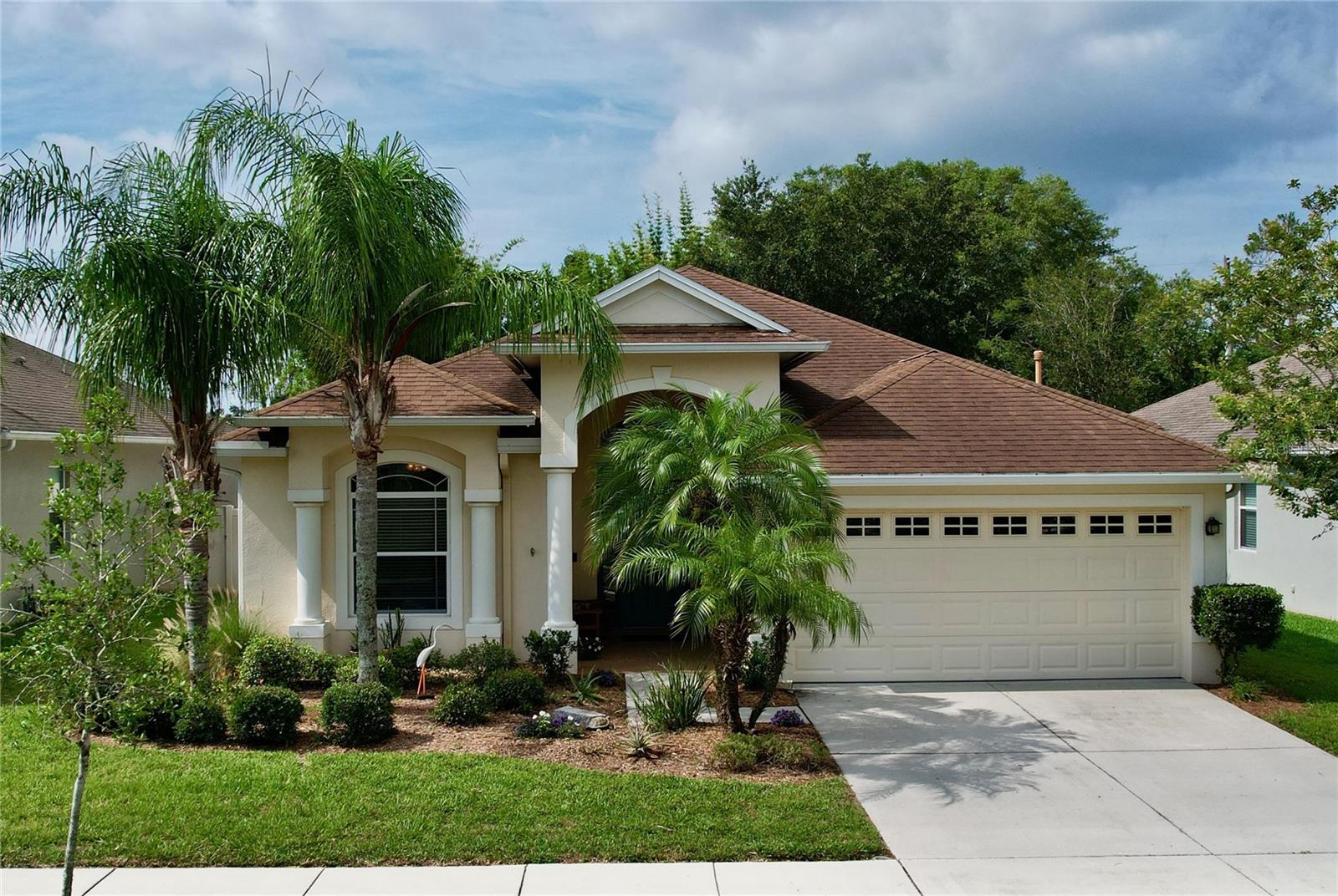 BEAUTIFUL SOUTHERN CRAFTED HOME IN the Gated Community of STONEGATE. 2167 Sq. Ft., 4 Bedroom, 2.5 Baths with High Ceilings, Architectural Archways & Decorative Columns. Covered front Entry with Elegant 8 FT Entry Door with Sidelights, lead you into the Foyer. Open Great Room has updated Floor Tile that Looks Like Wood and Crown Molding and Large Sliding Glass Doors for great Natural Lighting. Formal Dining Room has a Tray Ceiling. The Eat-In Kitchen beautiful Cabinetry with 42 In. Upper Staggered Cabinets w/crown accented with a tile backsplash, Serving Bar, Full Appliance Package and Sleek Granite counter Tops. The Primary Suite has a large walk-in closet and a secondary closet. The Master Bath has Crown Molding, a Double Sink Vanity plus a Shower, relaxing Garden Soaking tub and private commode. Split Bedroom Plan offers a 3-way Split with the 4th Bedroom at the very front of the house so it can easily serve as a den/office or bedroom. Bedrooms 2 & 3 have a shared bath between them. Interior Laundry. Convenient Half Bath for Visitors. Covered Lanai is screened and very private so you can enjoy a quiet morning coffee or evening beverage as the evening winds down. Extras Include: Insulated windows, additional attic insulation, exterior termite baiting system, palm trees and privacy wall at the back of the property. This Gated Community offers a Community Pool, playground, dock by the lake and Clubhouse at the Pool Pavilion. GREAT Location with easy Access to the Suncoast EXPY for commuting.