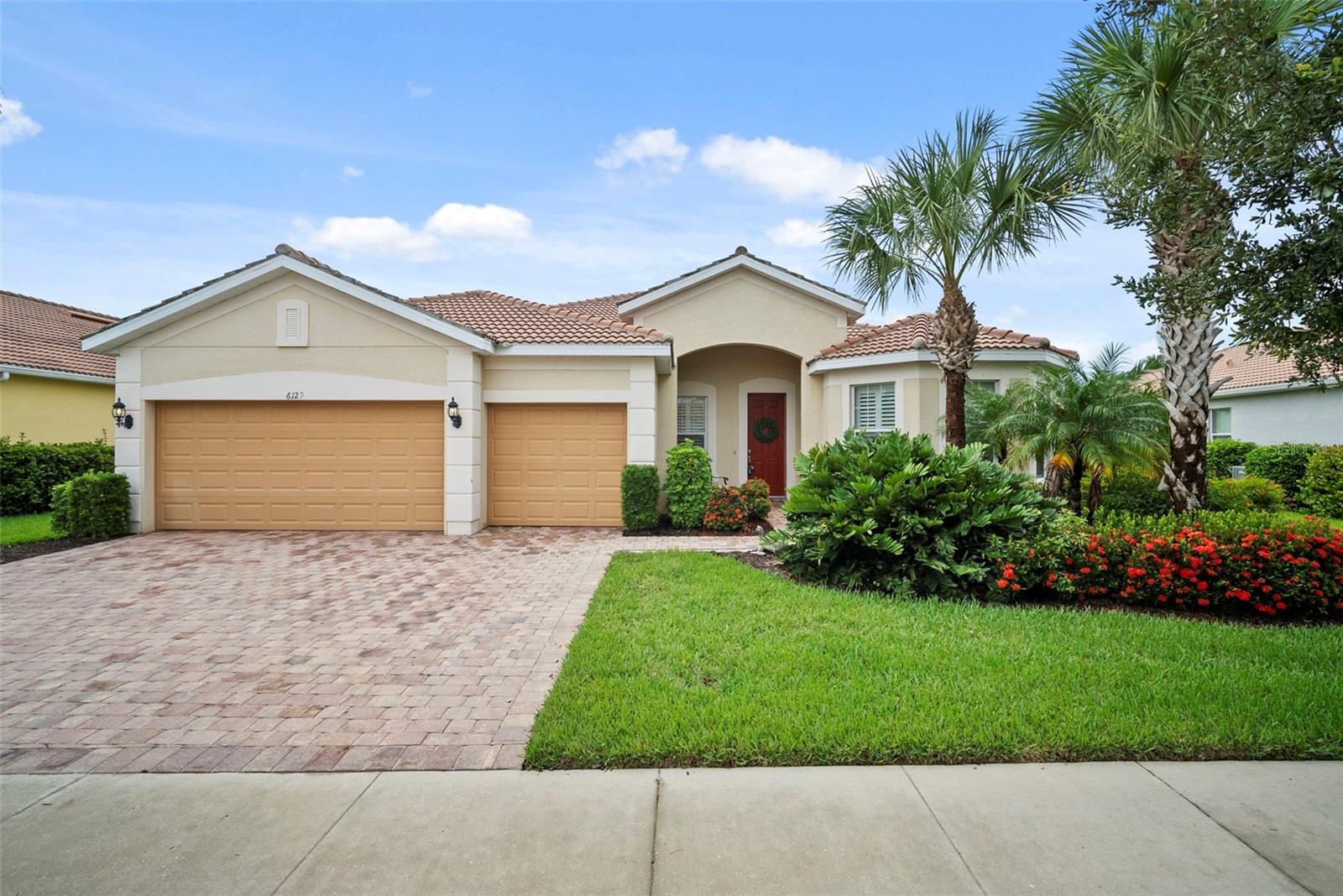 Stunning Waterfront Pool Home in The Isles of Sarasota. Welcome to this exquisite 3-bedroom, 3-bathroom home, beautifully decorated by a professional interior designer. Located in the highly sought-after Isles of Sarasota, this property offers the ultimate in luxury living, featuring breathtaking water views and exceptional amenities. As you step inside, you’ll be greeted by an open and inviting layout with a spacious gathering room adorned with crown molding, ceramic tile floors, and a cozy fireplace—perfect for relaxing and entertaining. The chef’s kitchen is a true standout, with an induction cooktop, built-in microwave and oven, a wine refrigerator, and a large closet pantry. The abundance of cabinet space will satisfy even the most discerning cooks. The primary suite is a true retreat, featuring a tray ceiling, a large ensuite bathroom, and a huge walk-in closet. Two additional guest bedrooms have ample space, with plantation shutters, large closets, and a guest bathroom for each. A den with engineered wood floors and plantation shutters provides an ideal space for a home office or reading nook. The outdoor living space is a true highlight, with a heated saltwater pool and spa, all overlooking serene water views. Whether you're hosting a gathering or enjoying a peaceful moment, the lanai offers plenty of room for relaxation and entertainment. Hurricane windows and a remote-controlled hurricane screen on the lanai provide added peace of mind during storm season. This home also offers a 2-car garage with a golf cart addition, a laundry room with ample cabinet space and a utility sink, as well as a brand-new air conditioner and refrigerator. The Isles of Sarasota community is a true gem, with a beautiful clubhouse, 4 Har Tru tennis courts, pickleball, basketball courts, a playground, and a resort-style pool. An activities director and full-time on-site manager ensure there's always something to do, while the monthly newsletter keeps residents up to date on the latest happenings. Conveniently located near shopping, dining, and the world-renowned Siesta Key Beach, this home is the epitome of luxury and convenience. Being sold turnkey furnished. Call today to schedule a private showing!