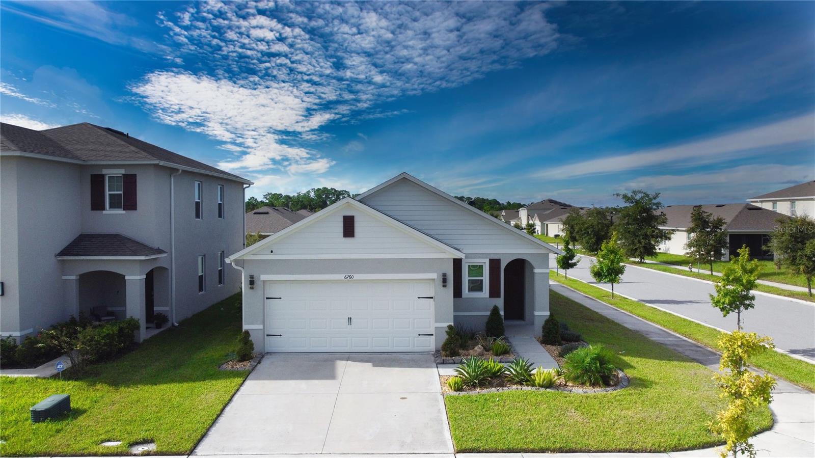 Welcome home to this move-in ready 3-bedroom, 2-bathroom smart technology, solar home sitting on a beautiful corner lot! As you walk into the foyer, you’ll find the formal dining room up front leading back into the open concept kitchen and living room. This open space offers high ceilings, recessed lighting throughout, and tile flooring for easy maintenance. At the back of the home is the primary bedroom with an oversized window drawing in the natural light. The beautiful ensuite features a double sink vanity and stand-up shower with a sliding glass door. Step out back to your covered patio overlooking the fully fenced backyard that is the perfect space for little ones to run around in year-round. Harmony offers trails for walking or biking, a lake for fishing, and resort-style pool and splash pad facilities. This home offers both tranquility and accessibility. Pet friendly!!!