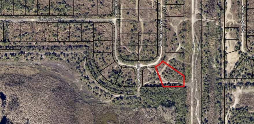 Oversized lot located in Unit 51 of Port Malabar.  There are no utilities in this area at this time.  Buy to eventually build or hold onto as an investment.