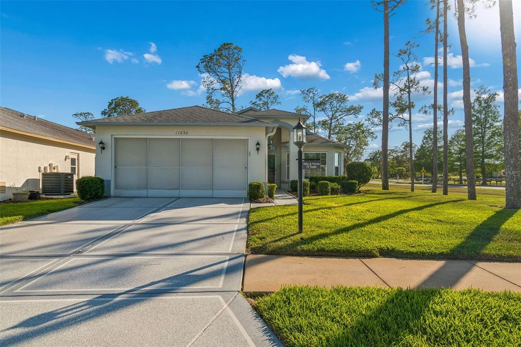 Photo of 11630 Wheatfield Loop, Hudson, FL 34667 (MLS # W7885438)