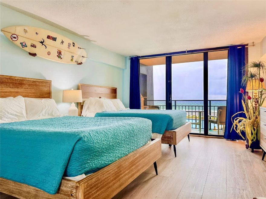 Experience the ultimate coastal lifestyle with this beautifully remodeled waterfront condo, perfectly situated in the heart of Daytona Beach! This modern retreat offers everything you need for a carefree, turnkey move-in or an ideal investment property. Inside, ALL NEW INTERIOR PAINT, you’ll find a fully equipped kitchen and a sleek full bathroom, complemented by stylish finishes and beach-themed décor throughout. The condo comes fully furnished—2 queen sized beds and a sleeper sofa - complete with plateware, silverware, glassware, bedding, towels, and more—so you can settle in from day one. Step out onto the large private balcony and soak in sweeping views of the sparkling pool, on-site restaurant, and of course, the breathtaking Atlantic Ocean. Whether you’re sipping your morning coffee or enjoying evening cocktails, the balcony is your front-row seat to the best of Daytona Beach.
The resort-style amenities are endless, featuring a pool deck perfect for sunbathing, arcade games for added fun, and plenty of parking for convenience. Beyond the property, you’ll be minutes from Daytona International Speedway, Daytona Beach International Airport, the iconic Daytona Beach Pier, plus a variety of shopping, dining, and entertainment options. This condo offers the perfect blend of modern comfort, unbeatable location, and vacation-ready living.