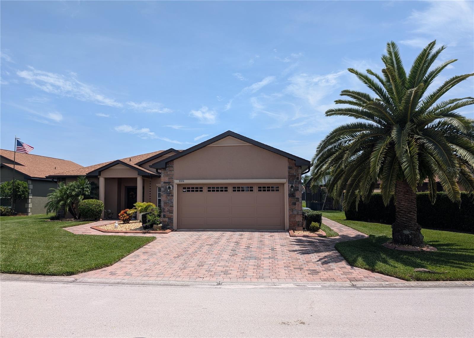 ***Motivated Seller*** Your Florida Oasis Awaits!! Step into comfort and convenience with this beautifully maintained 2-bedroom, 2-bathroom home featuring a flexible den and a brand-new roof (June 2025). Arrive to a paver driveway, lush landscaping with a mature palm, handicap-accessible entry and wraparound sidewalks for ease and functionality. Inside, the popular Devon floor plan offers an extended kitchen for added space and versatility. The primary suite is a true retreat, boasting dual vanities, a walk-in shower with safety grab bars, and pocket doors that enhance flow and accessibility. The guest bath also includes grab bars for added peace of mind. Relax and entertain in your private, screened-in pool with serene views of green space and a seasonal lake perfect for soaking up the Florida sunshine. Hurricane shutters provide extra security and confidence. This home is nestled in the sought-after Lake Ashton community, offering resort-style amenities, two gated entrances with 24/7 guard services. The community features a stunning clubhouse with a grand ballroom, a movie theater, bowling lanes, and a pool. Dining options include the on-site restaurant, Charm City and Eagle Nest. Stay Active! For recreation, residents can enjoy card, craft, and billiard rooms, a fitness center, bocce courts, shuffleboard, tennis courts, and a half-court basketball area. The Health and Fitness Facility offers an indoor lap pool, indoor half-court basketball, full-court racquetball, a fitness center, tennis and pickleball courts, and more.