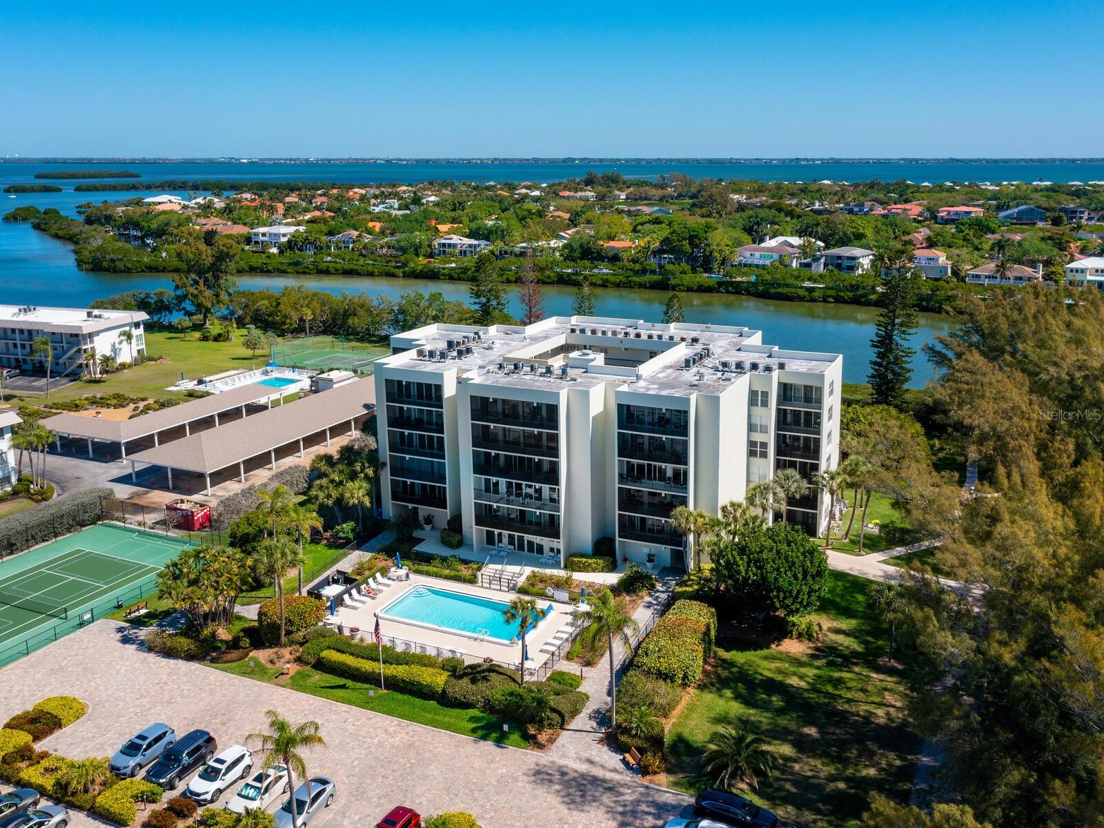 This well-appointed, fully furnished, two-bedroom, two-bath Portobello residence is so close with deeded access to Longboat Key's 10-mile beach. This impeccably maintained convenient ground-level home is in pristine condition, and a spaciously designed, coastal-inspired interior creates feelings of tranquility and hospitality. The primary living space enjoys abundant natural light from sliding glass doors opening onto a screened and covered lanai for your relaxation and added dining alfresco. The kitchen has all appliances and granite countertops with passageway to the dining area. The primary bedroom has sliding glass doors to the lanai with en-suite bath and generous walk-in closet, and a guest wing offers every comfort with its sliding glass door to the lanai too. Portobello gives support and comfort to owners with a full-time on-site maintenance crew. You and your family and friends will love the outdoor activities that are near such as LBK Town Center, the beach, miles of pedestrian walkways and more miles of designated bikeways, golf, fishing, Bayfront Park with pickleball, treed dog park and amenities for all ages, staffed USTA award-winning public 10 Har-Tru clay tennis courts and the renowned one-of-a-kind mecca for shopping and dining at St. Armands Circle. L-I-V-I-N the dream on Longboat Key. News Flash! Starbucks to open on LBK late Summer 2025 at midkey 3174 Gulf of Mexico Drive. We are walking distance away, and a $100 gift certificate will be given to Buyer.