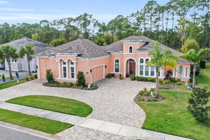 Step into a world of refined luxury with this exquisite 5-bedroom, 4½-bathroom residence, masterfully crafted in 2019 and spanning an impressive 3,237 square feet of sophisticated living space. This architectural gem seamlessly blends timeless charm with modern convenience, offering an unparalleled lifestyle for the discerning homeowner. The heart of the home is a gourmet kitchen that radiates opulence, featuring lustrous granite countertops, a grand island with a sink, and a bespoke coffee bar that transforms morning rituals into an art form. Bar seating and a generous pantry enhance functionality, while recessed lighting casts a warm glow over the 24x24-inch porcelain tile flooring that flows gracefully throughout the residence. Crown molding adorns every room, adding a touch of regal character, complemented by 8' interior doors and 5¼'' baseboards that elevate the aesthetic to new heights.

The living room, a masterpiece of design, boasts a soaring 13' ceiling with tray accents, surround sound, and remote-controlled blinds that frame a stunning 4-panel pocket slider with impact glass. This opens to an outdoor living sanctuary where sophistication meets nature: an outdoor kitchen, paver fire pit, ceiling fans, recessed lighting, and outdoor speakers create an entertainer's paradise, enclosed by a sleek black wrought iron fence and accented with gutters for seamless style.

Retreat to the primary suite, a haven of tranquility featuring expansive his-and-her walk-in closets and a double tray ceiling that adds depth and grandeur. The en-suite master bath is a spa-inspired escape, complete with dual sinks, a luxurious garden tub, and a separate shower stall designed for indulgence. An in-law suite, equally refined with surround sound and meticulous detailing, offers versatility and comfort for guests or extended family.

Beyond the interiors, this home includes an oversized 2-car garage with pull-down stairs leading to attic storage, seamlessly connected to an RV garage perfect for the modern adventurer or collector seeking both luxury and practicality. From the tray-ceilinged entryway to the circular paver driveway and block-and-stucco exterior adorned with decorative corbels, every detail of this home exudes distinction. Modern luxuries like remote-controlled blinds in the kitchen nook and living room, paired with timeless touches like crown molding, make this residence a rare find, a harmonious blend of innovation and grace, ready to welcome you home.