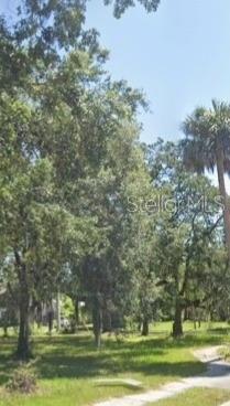 Outstanding buildable corner lot in Sanford, FL 32771. Located on corner of Celery Ave and Locust. Clear to build with trees. House previously on lot that has been removed.