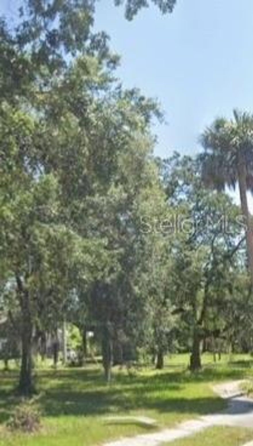 Outstanding buildable corner lot in Sanford, FL 32771. Located on corner of Celery Ave and Locust. Clear to build with trees. House previously on lot that has been removed.