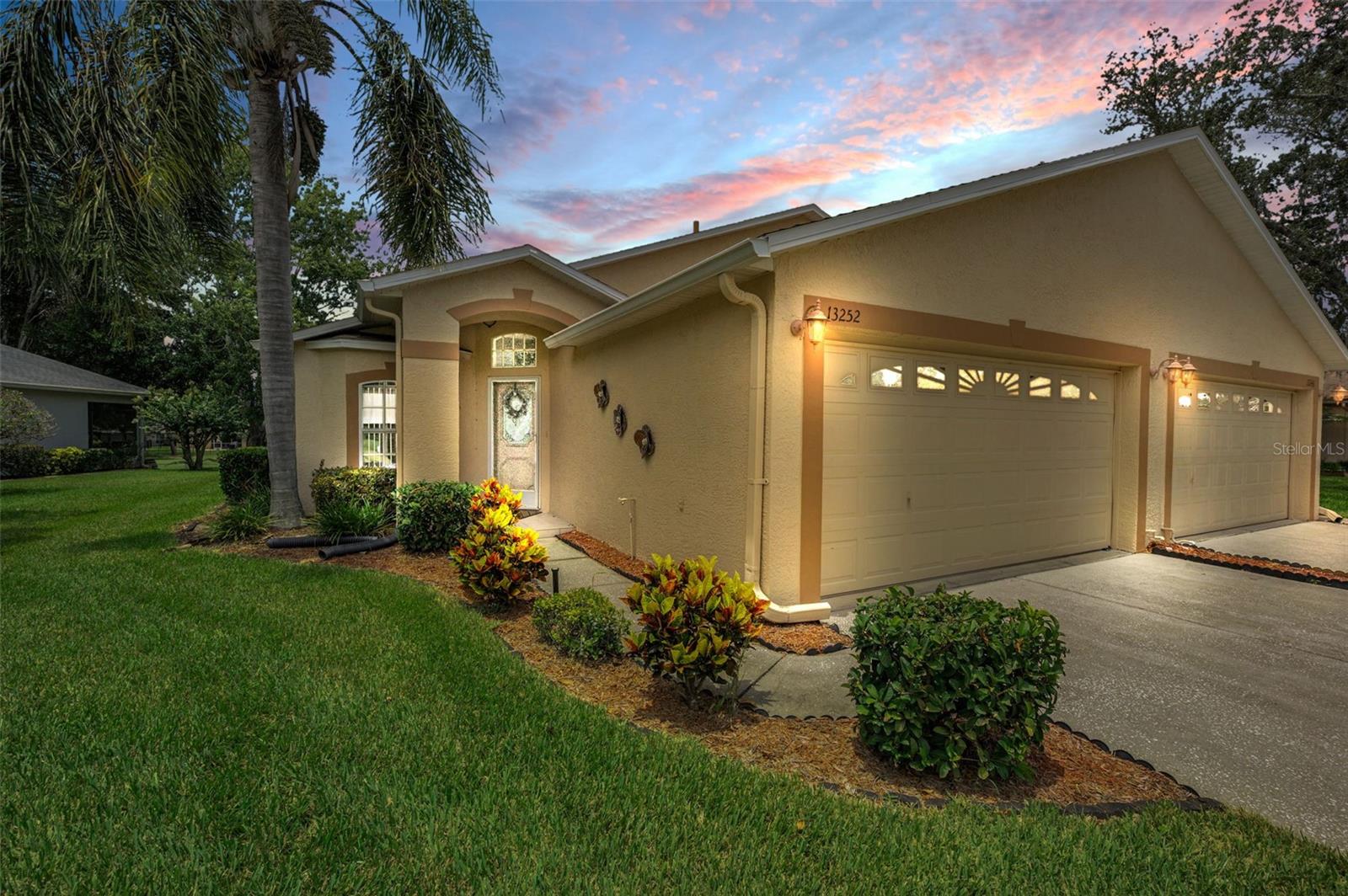 Best value in the neighborhood with easy, low-maintenance living! Enjoy this spacious 2 bedroom, 2 bathroom villa with 1,265 square feet of living space, high ceilings, and a 2-car garage! Located in the beautiful Meadow Oaks Golf Community where golf carts and pets are allowed! All ages are welcome - this is NOT a 55+ community. This well-maintained home features an open layout, stainless steel appliances, a walk-in closet in the primary suite, and an en-suite bathroom with a linen closet for added convenience. Offered fully furnished if desired, the home includes an expansive covered and screened patio with blinds and paver flooring, perfect for relaxing or entertaining while enjoying peaceful views of the 14th hole on the community’s public 18-hole golf course that has a pro shop and restaurant. Additional updates include a hot water heater in February of 2025, Roof in 2018, and an A/C unit in 2016. The community offers a wide range of amenities including a clubhouse with a fitness center, billiards, library, and meeting room, as well as outdoor features like a heated pool, tennis, pickleball, basketball, shuffleboard, and bocce ball - perfect for staying active and social. This prime location is close to restaurants, shopping, and medical facilities for everyday ease and is only 34 miles from Tampa International Airport. It is also just 9 miles to the beautiful SunWest Park Beach. This property is also close to some of Florida’s most beautiful natural attractions: just 17 miles to Weeki Wachee State Park, where you can explore the deepest known freshwater cave system in the country and enjoy live mermaid shows; 44 miles to Homosassa Springs State Park, known for its crystal-clear river, springs, and manatees; and only 51 miles to the award-winning white sands of Clearwater Beach. Whether you're looking for a full-time residence or a seasonal getaway, this villa combines comfort, lifestyle, and location in one incredible package.